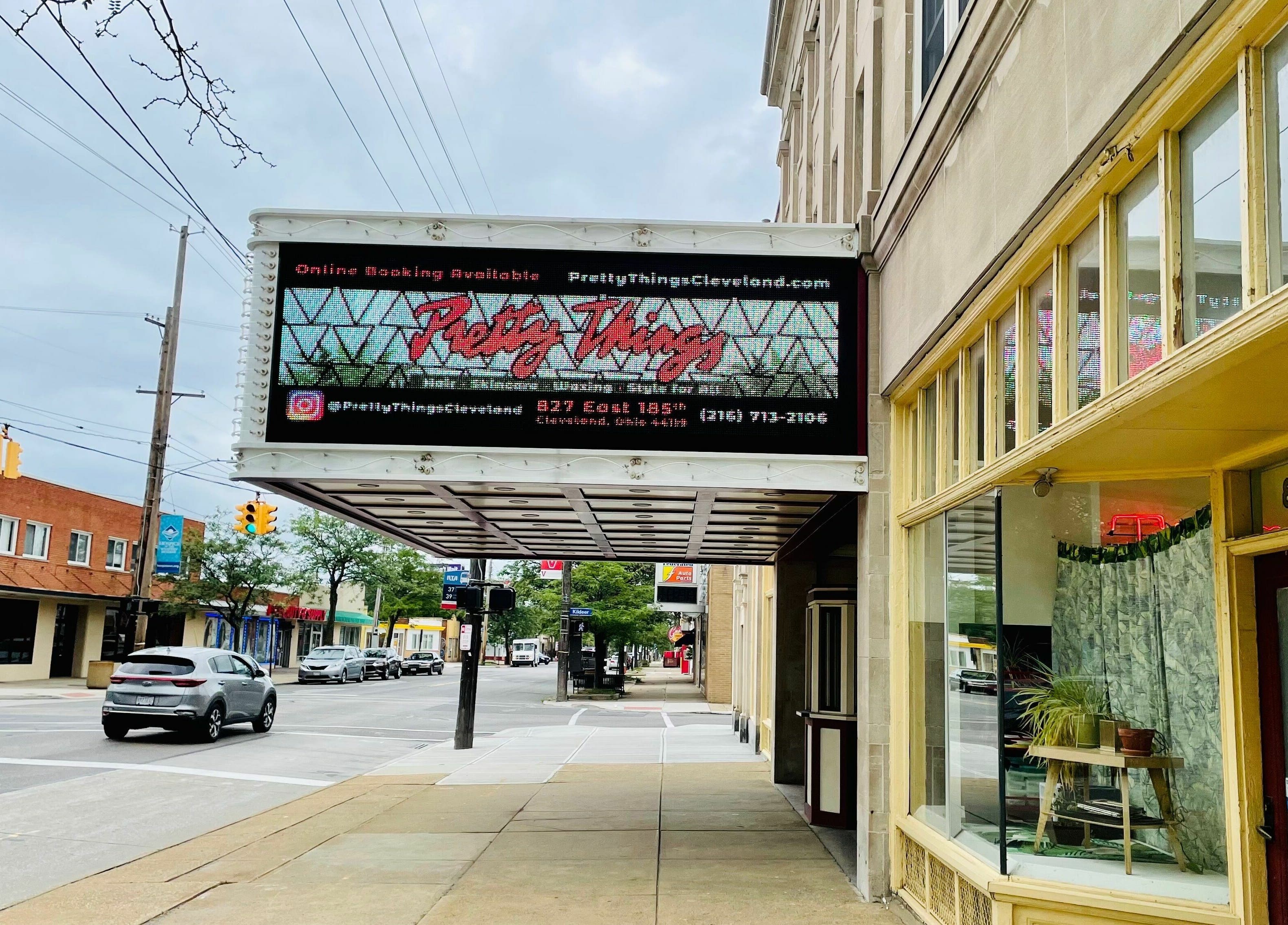 Pretty Things Salon's chic exterior on a bustling street in Cleveland, Ohio, US.