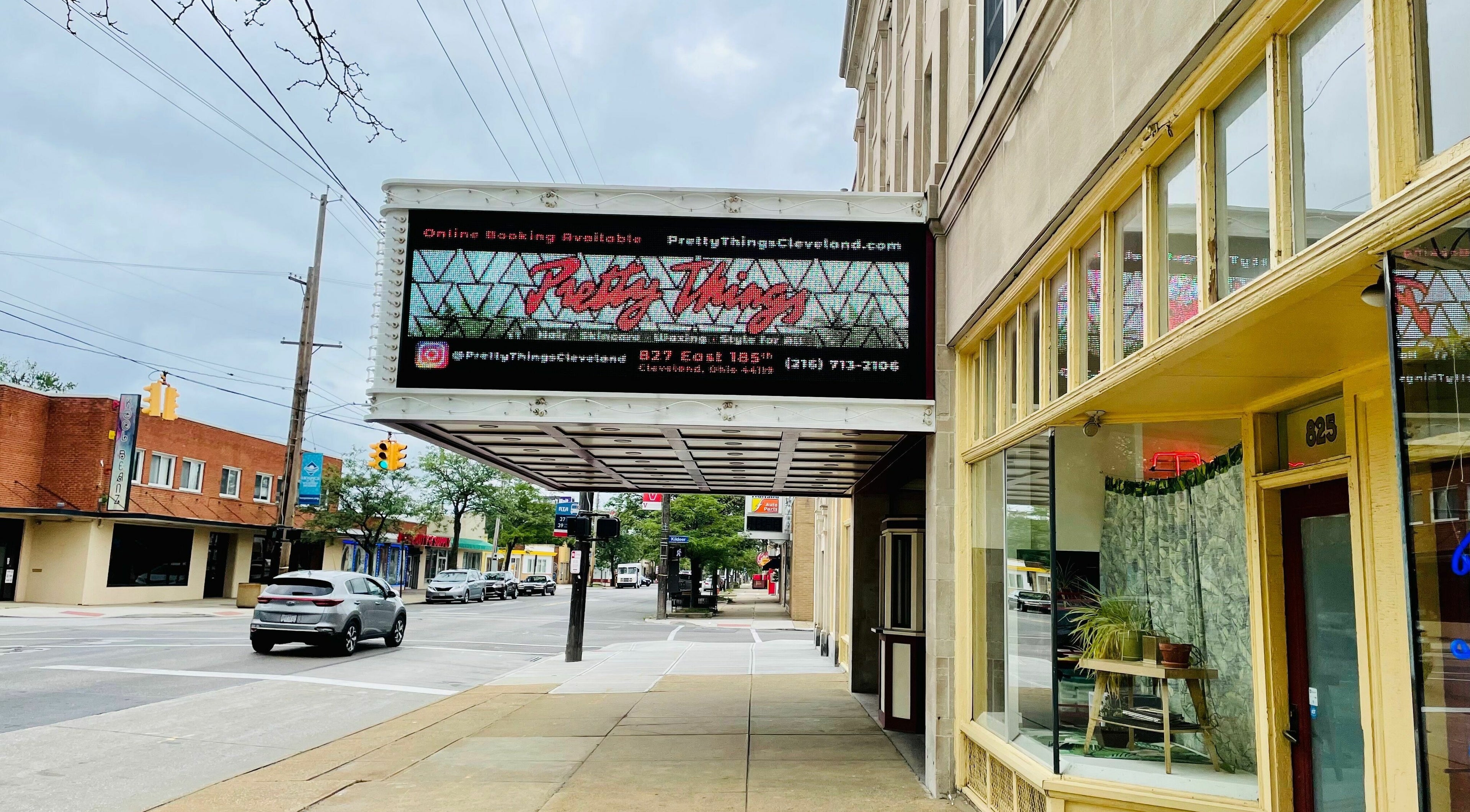 Pretty Things Salon's chic exterior on a bustling street in Cleveland, Ohio, US.