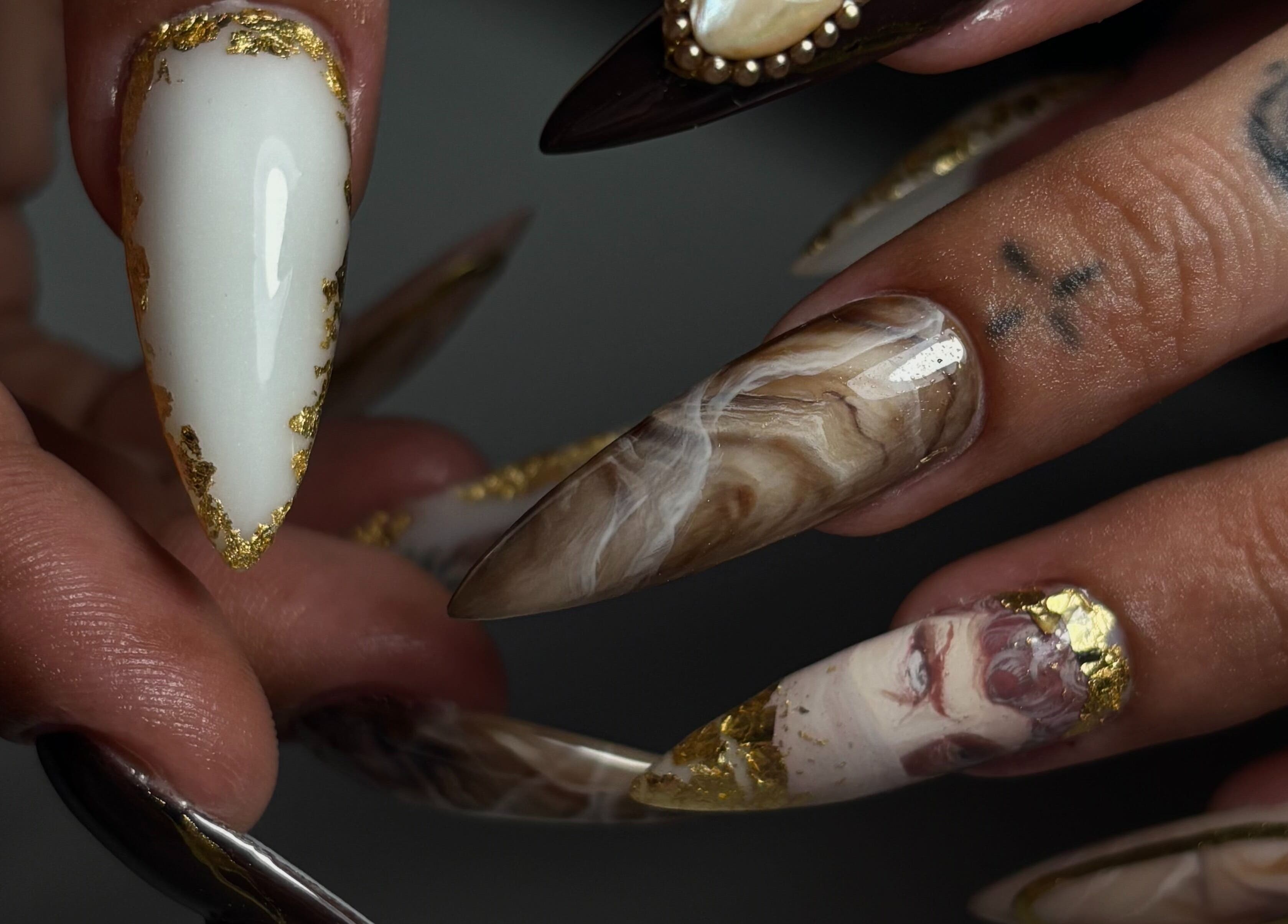 Elegant nail art with gold accents at Sterling Co., New Plymouth, Taranaki, NZ.