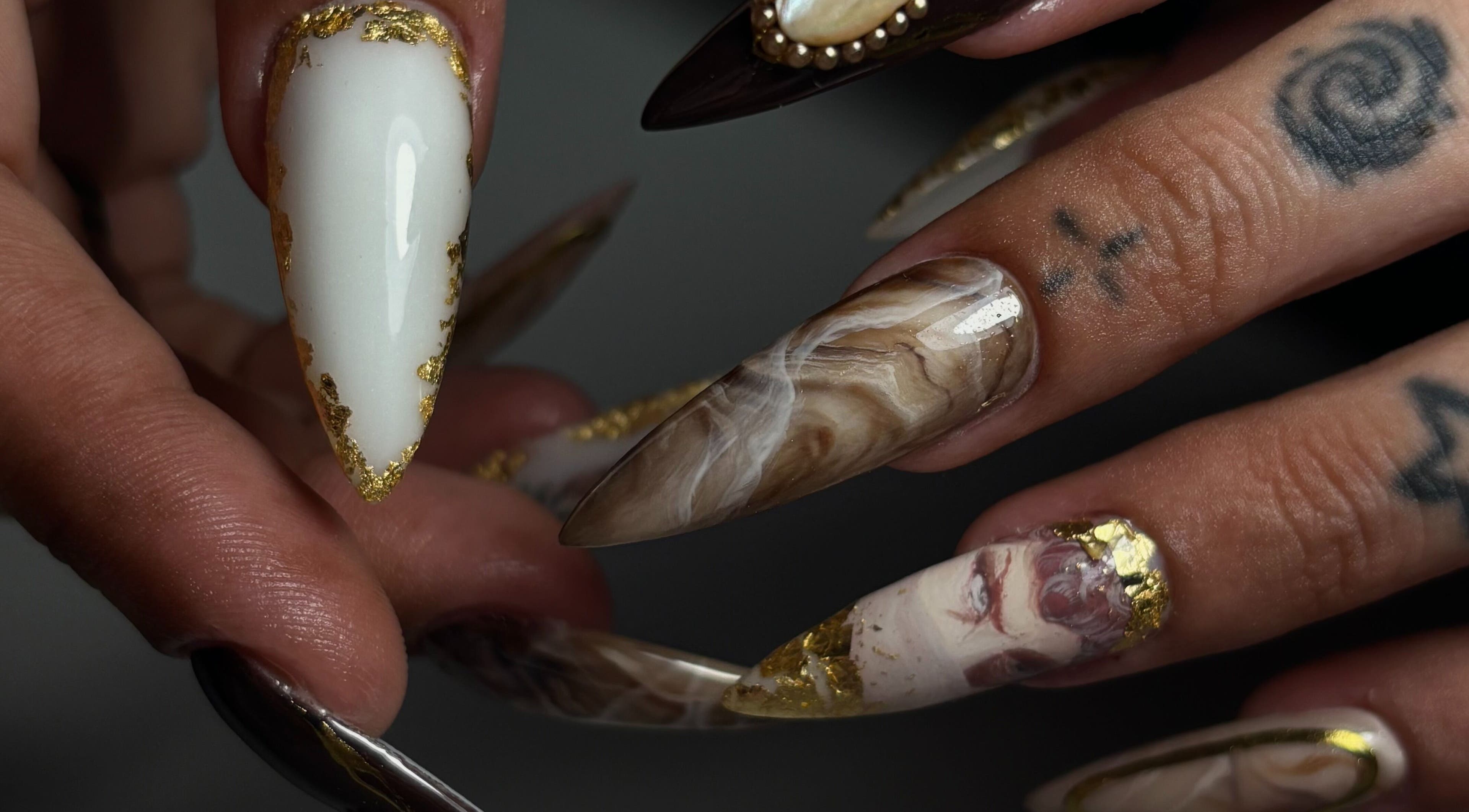 Elegant nail art with gold accents at Sterling Co., New Plymouth, Taranaki, NZ.