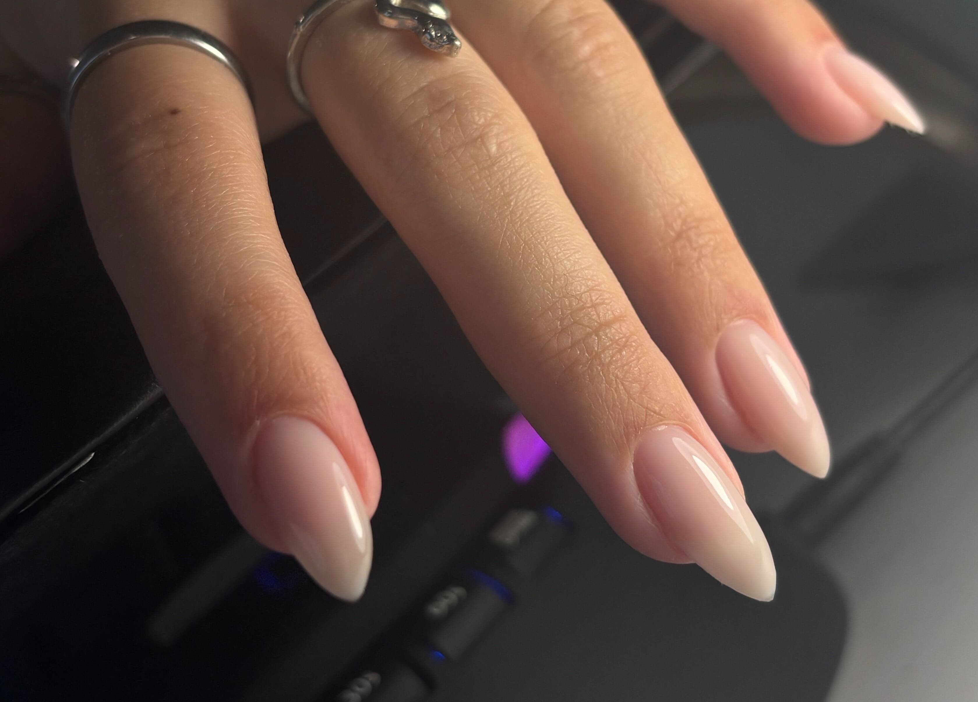 Close-up of elegant manicured hand with rings at Sterling Co., New Plymouth, Taranaki, NZ.