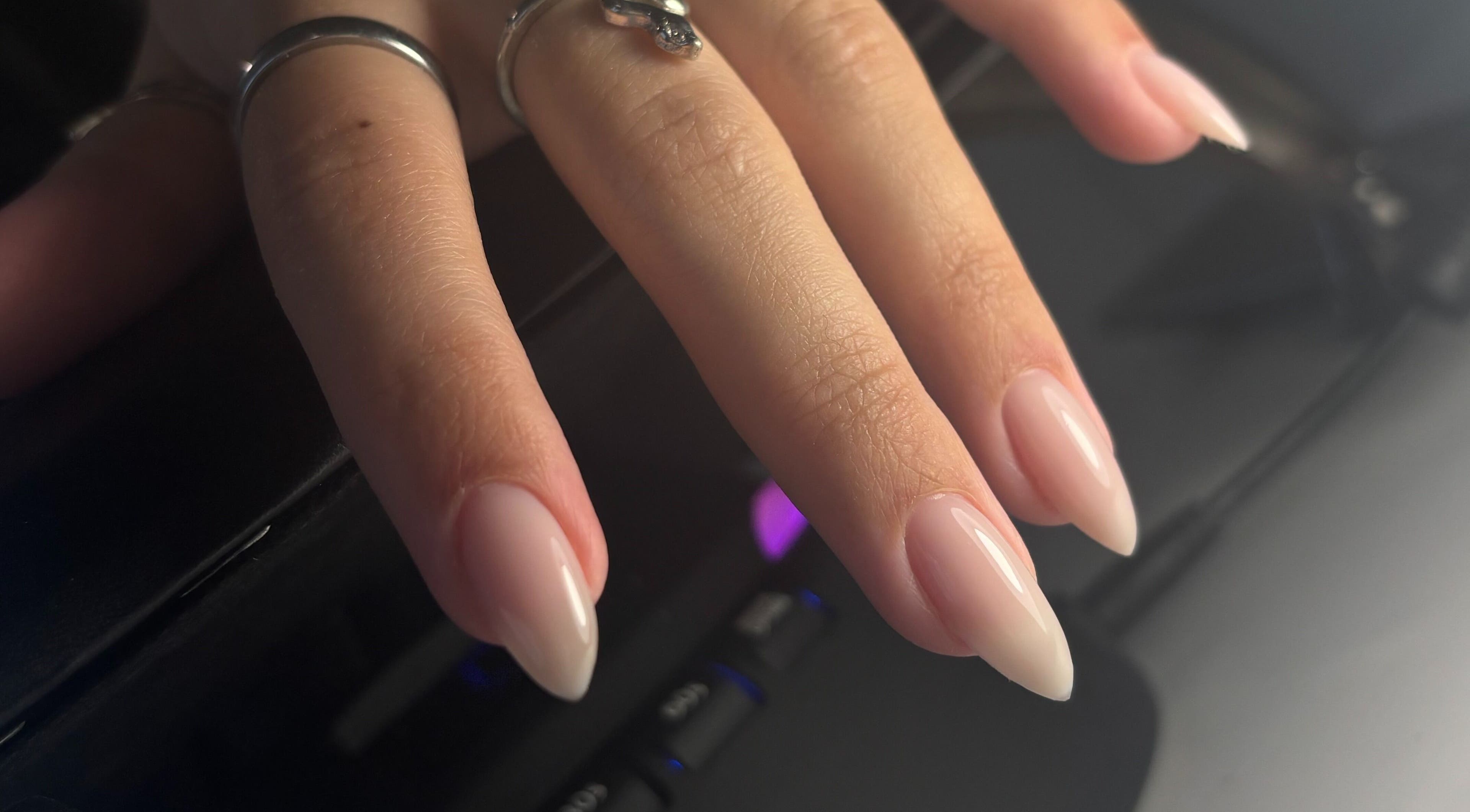 Close-up of elegant manicured hand with rings at Sterling Co., New Plymouth, Taranaki, NZ.