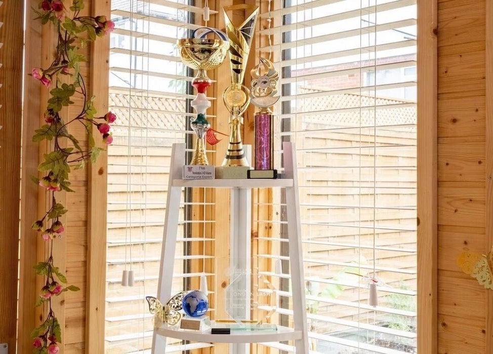 Awards display at Lashes by Shareen, Kettering, England, GB with natural light and floral decor.