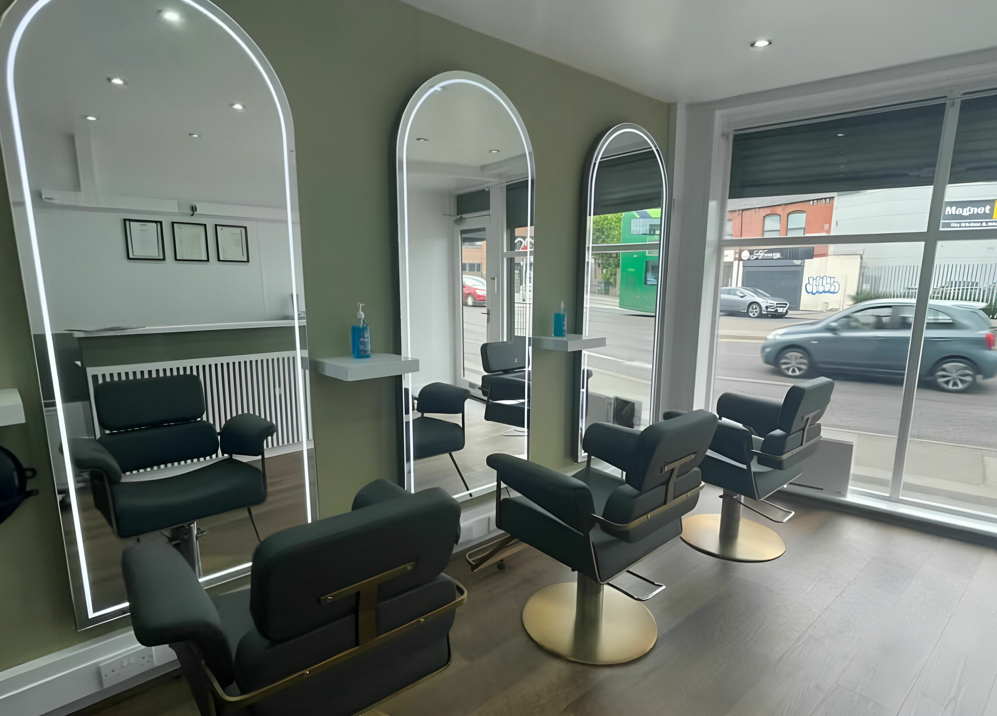 Elegant salon mirrors at Verde Hair Salon, Leeds, England, GB with modern chairs and decor.