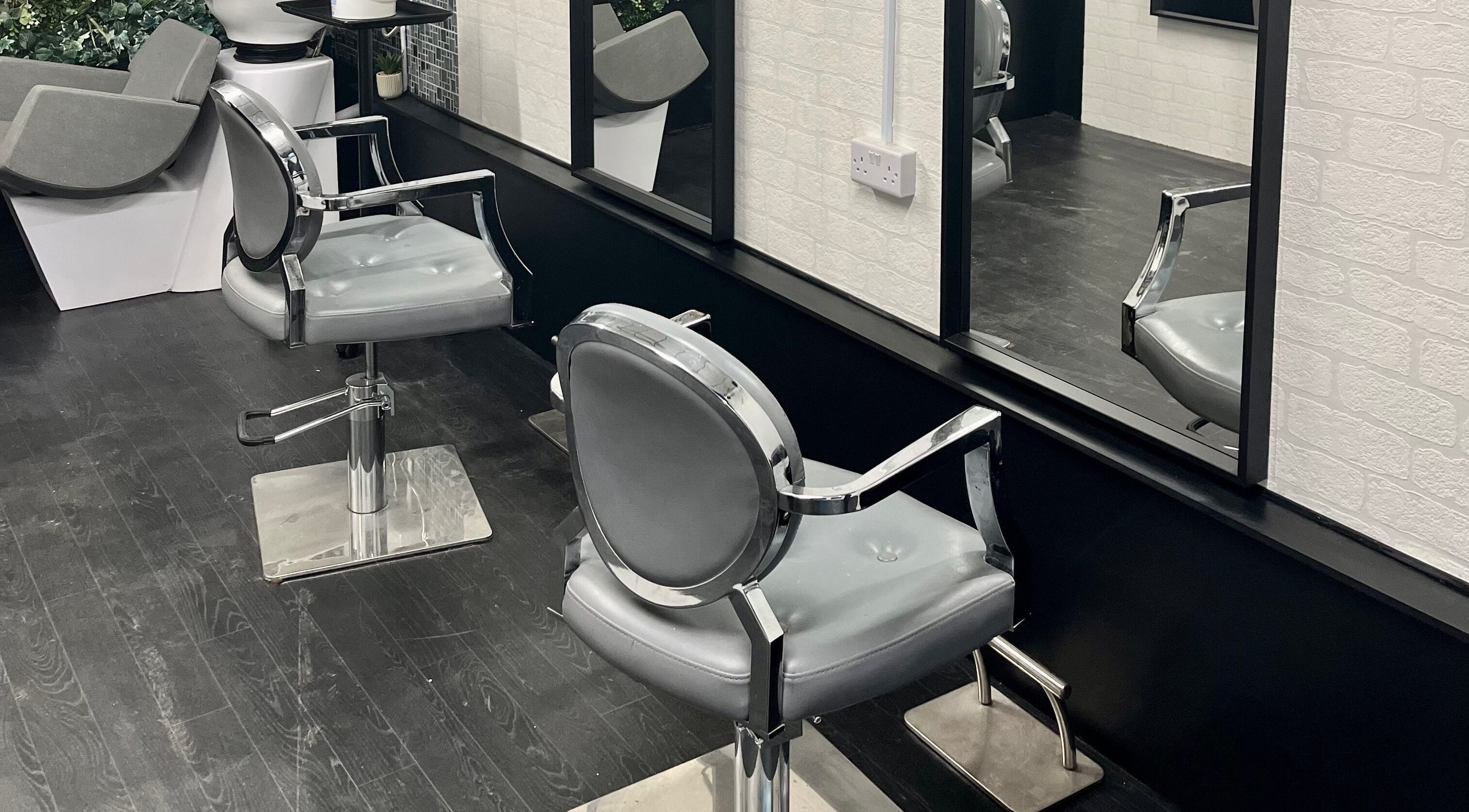 Modern hair salon chairs and mirrors at Loraine Davies Hair in Telford, England, GB.