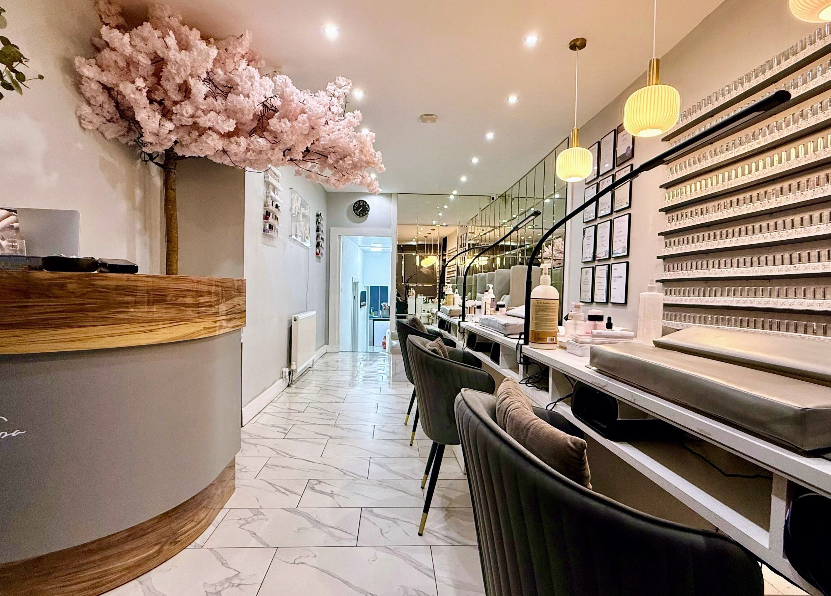 Elegant interior of Nail Spa in Penarth, Wales, GB, showcasing manicure stations and chic decor.