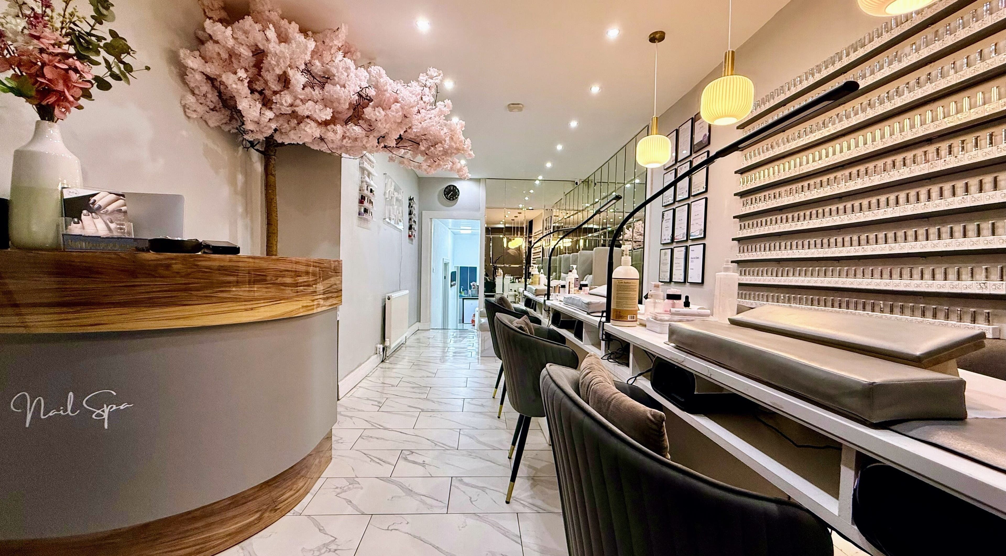 Elegant interior of Nail Spa in Penarth, Wales, GB, showcasing manicure stations and chic decor.