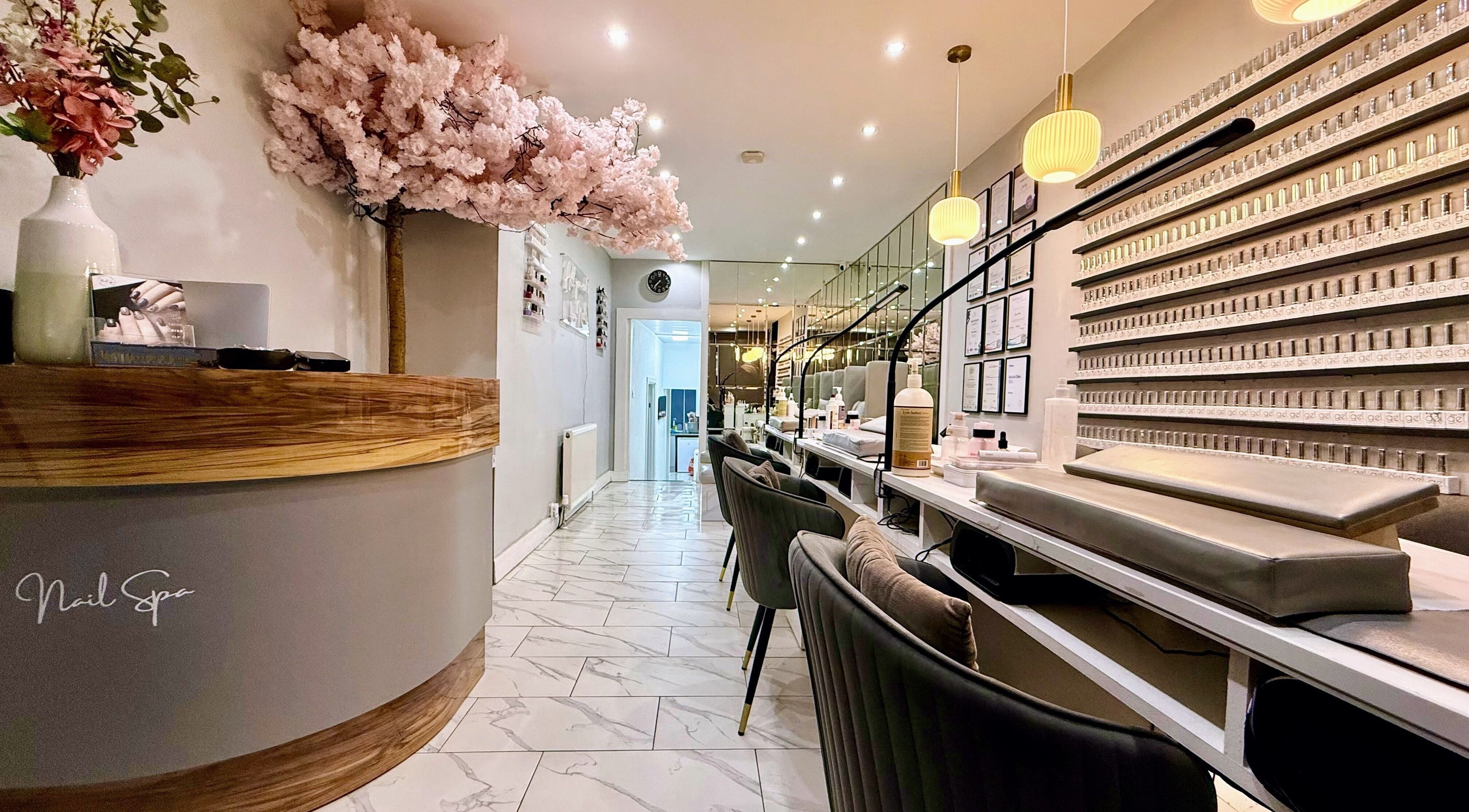 Elegant interior of Nail Spa in Penarth, Wales, GB, showcasing manicure stations and chic decor.