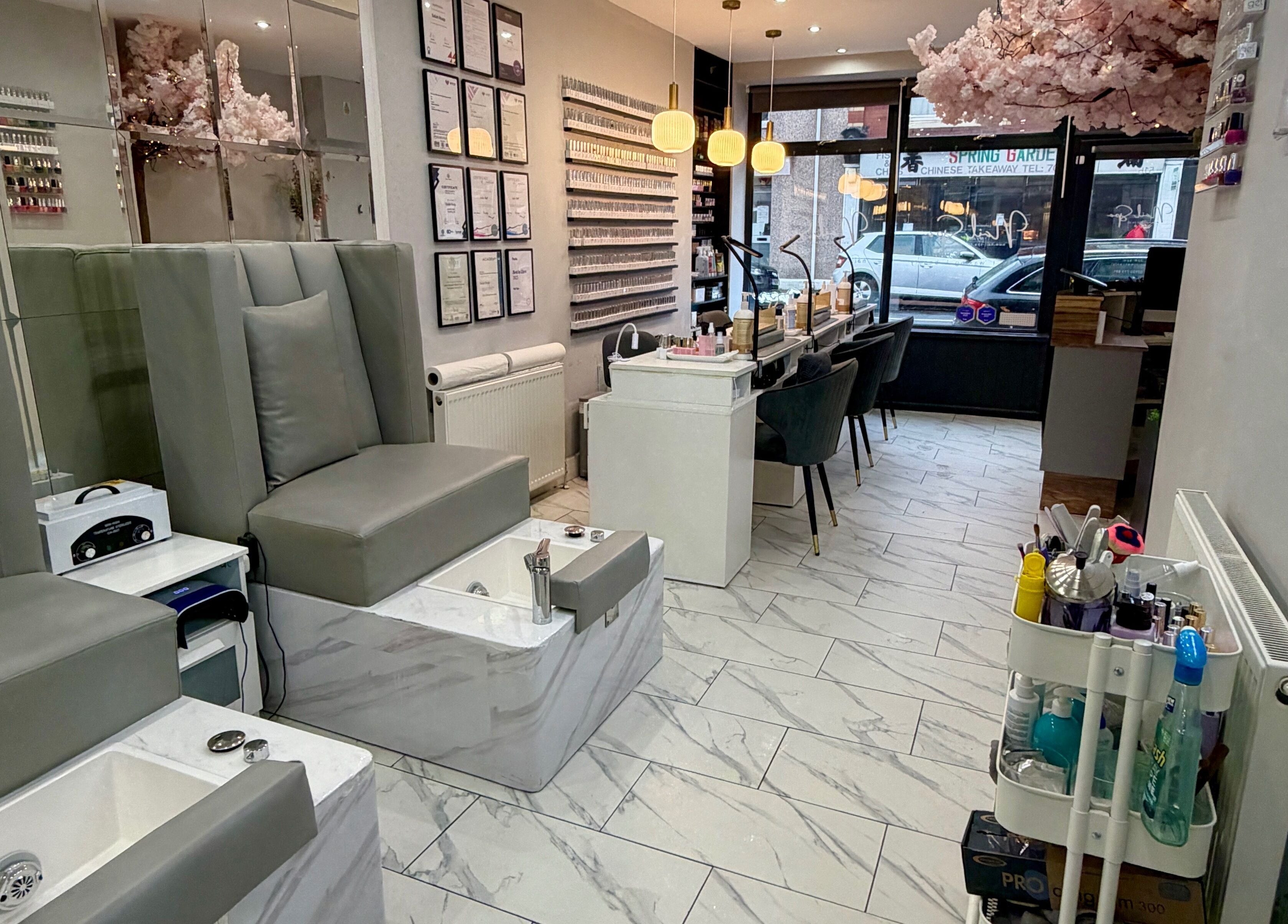 Chic interior of Nail Spa in Penarth, Wales, GB featuring plush seating and modern decor.
