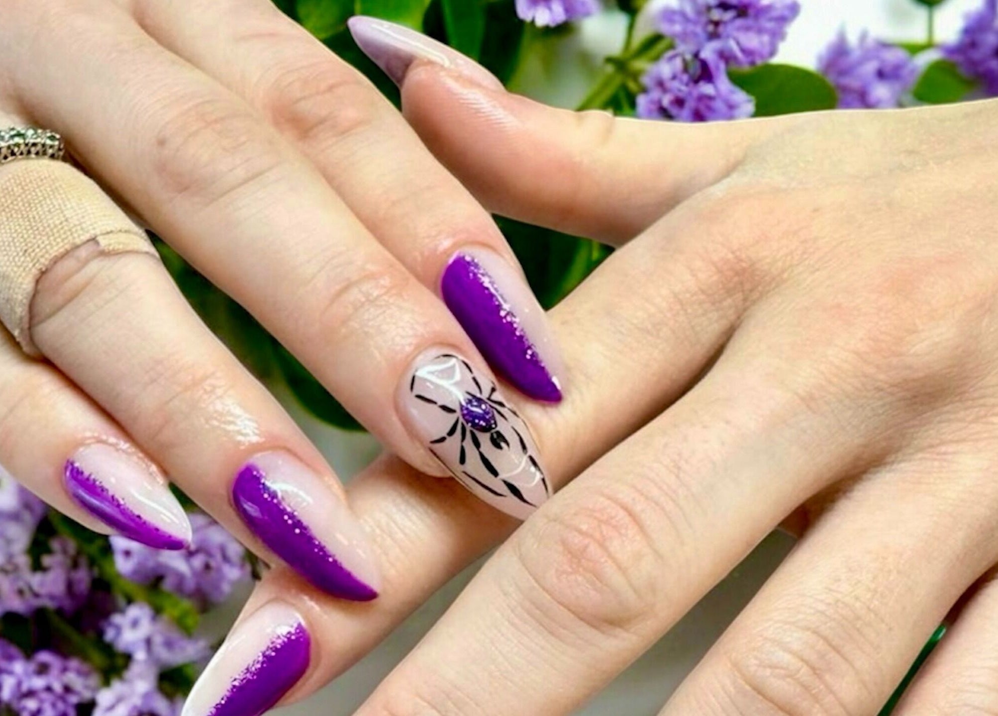 Elegant purple manicure at Nail Spa, Penarth, Wales, GB. Delicate floral nail art design.