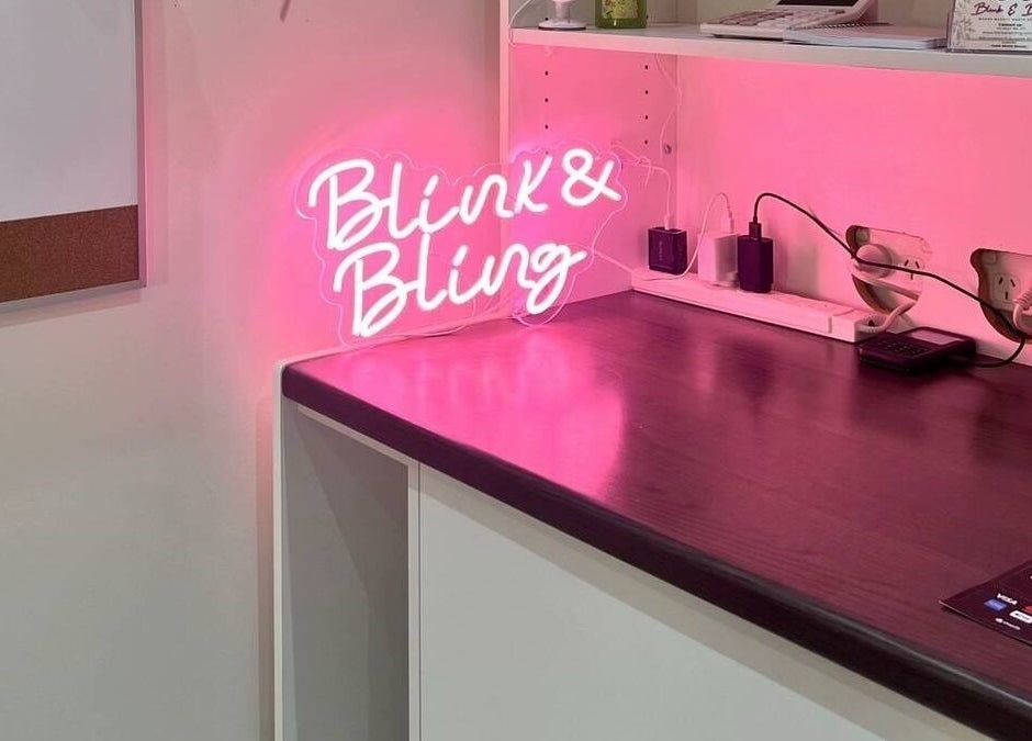Neon Blink & Bling sign glowing in pink at Gungahlin, Australian Capital Territory, AU venue.