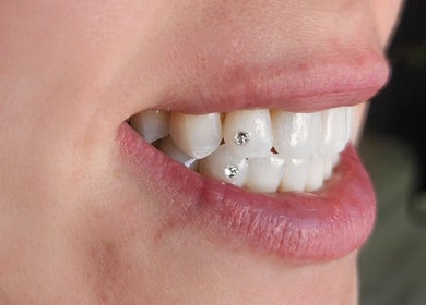Tooth gems at Tash's Tanning in Beldon, Western Australia, AU, offering unique dental styling.