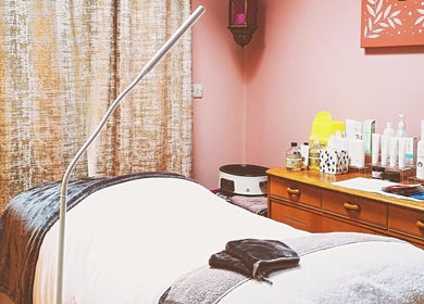 Tranquil massage room at Magic Place Massage and Facial Therapy, Bristol, England, GB, showcasing therapy essentials.