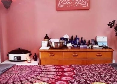 Cozy treatment room at Magic Place Massage and Facial Therapy, Bristol, England, GB with calming pink decor.