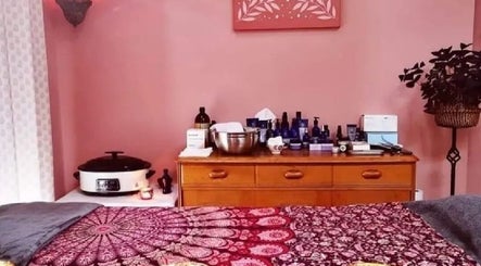 Cozy treatment room at Magic Place Massage and Facial Therapy, Bristol, England, GB with calming pink decor.