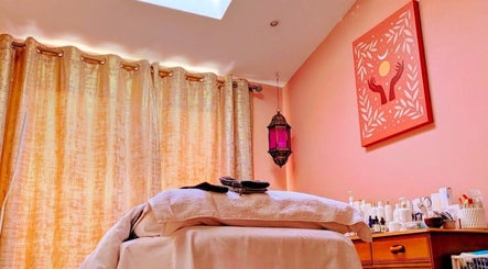 Relaxing massage room at Magic Place Massage and Facial Therapy in Bristol, England, GB with warm decor.