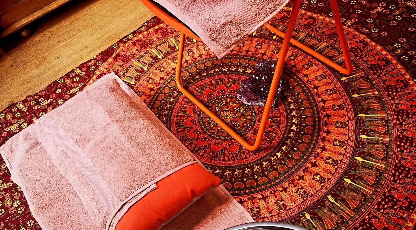 Cozy massage setup at Magic Place Massage and Facial Therapy, Bristol, England, GB with colorful decor.