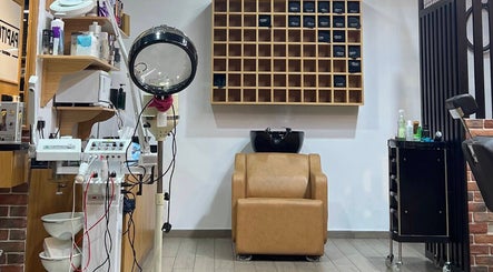 Modern barber workspace at Papito Barbershop in Dubai, Dubai, AE. Featuring tools and sleek barber chair.