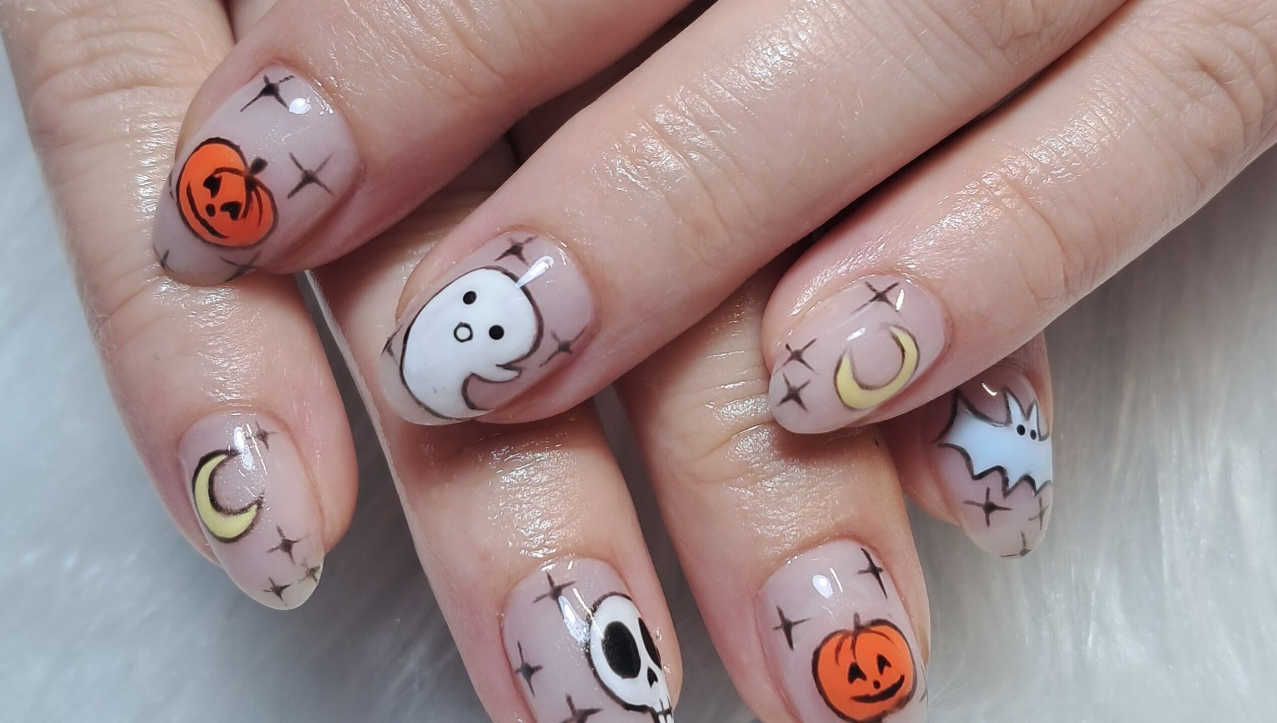 Halloween-themed nail art at Scratch Pad Nails in Waddington, England, GB with pumpkins, ghosts, and more.