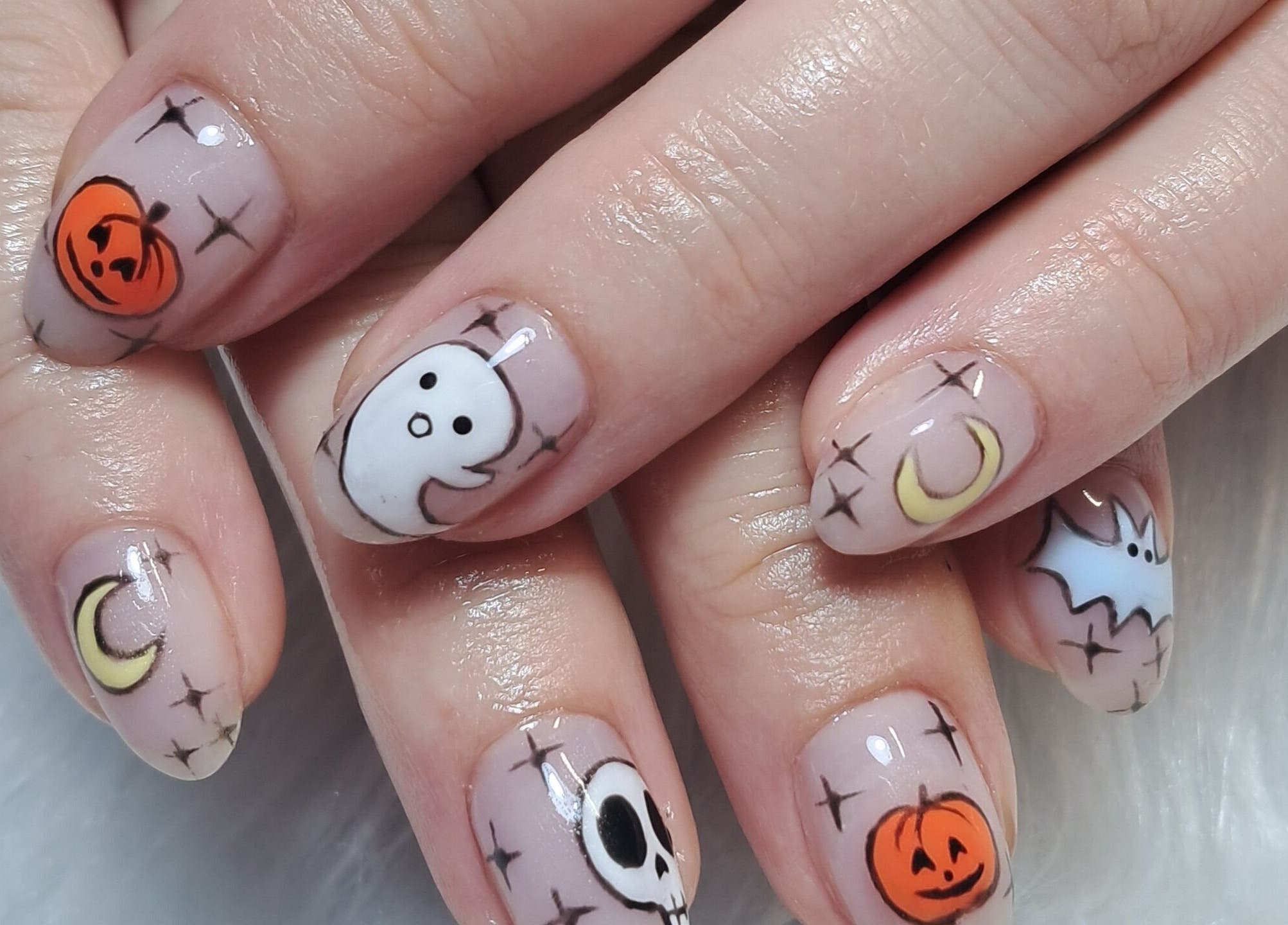 Halloween-themed nail art at Scratch Pad Nails in Waddington, England, GB with pumpkins, ghosts, and more.