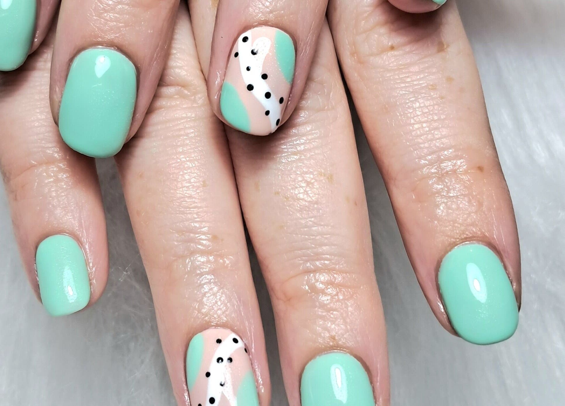 Stylish mint and polka dot nail art at Scratch Pad Nails, Waddington, England, GB.