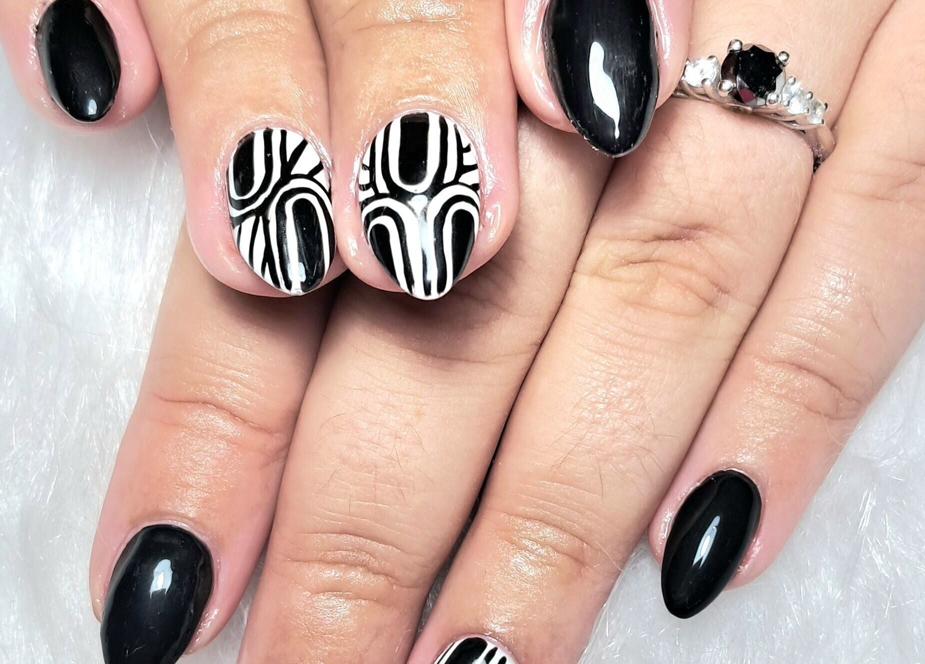 Stylish black and white nail art at Scratch Pad Nails in Waddington, England, GB.