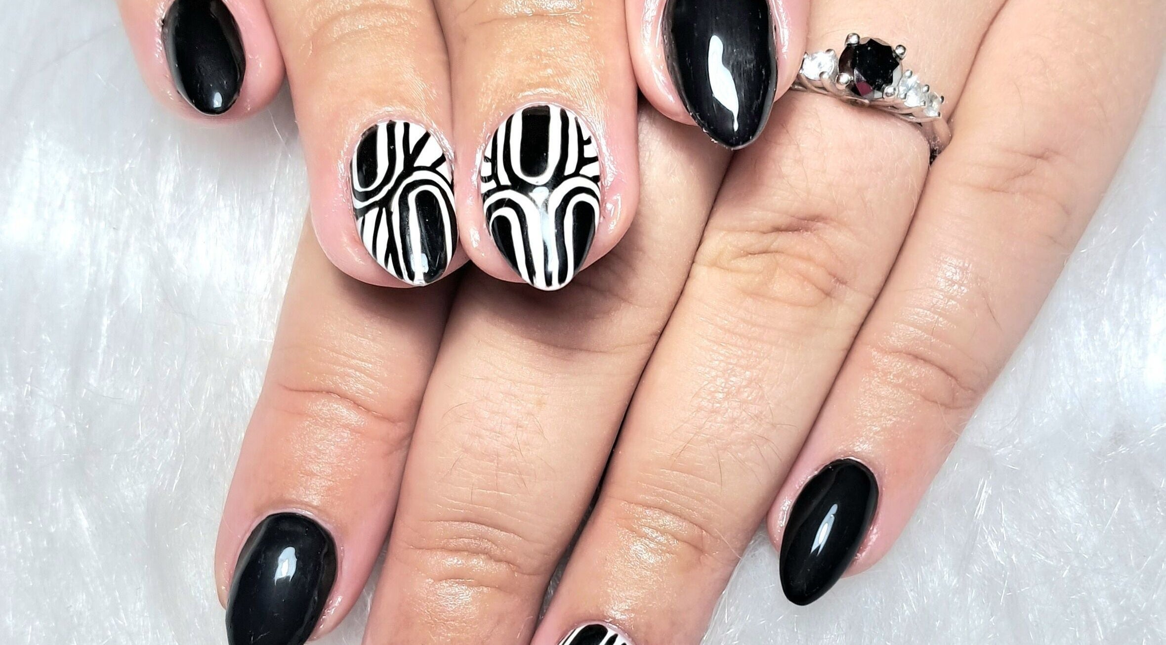Stylish black and white nail art at Scratch Pad Nails in Waddington, England, GB.