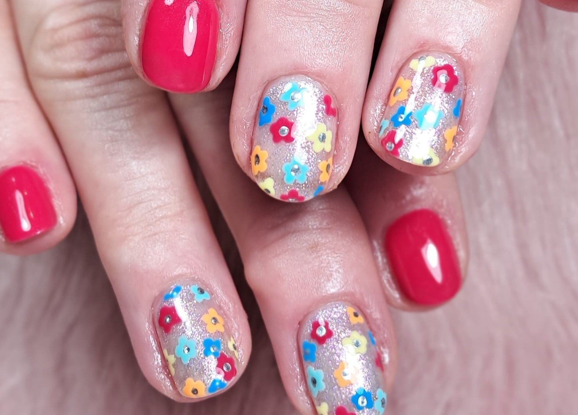 Detailed floral nail art at Scratch Pad Nails, Waddington, England, GB, featuring vibrant colors and creative design.