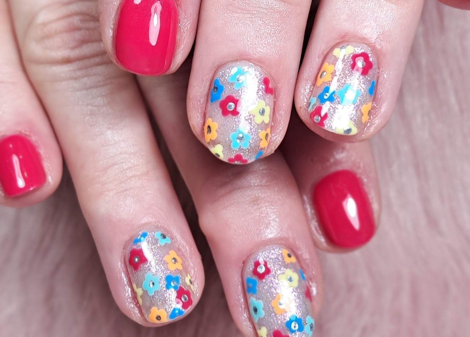 Detailed floral nail art at Scratch Pad Nails, Waddington, England, GB, featuring vibrant colors and creative design.