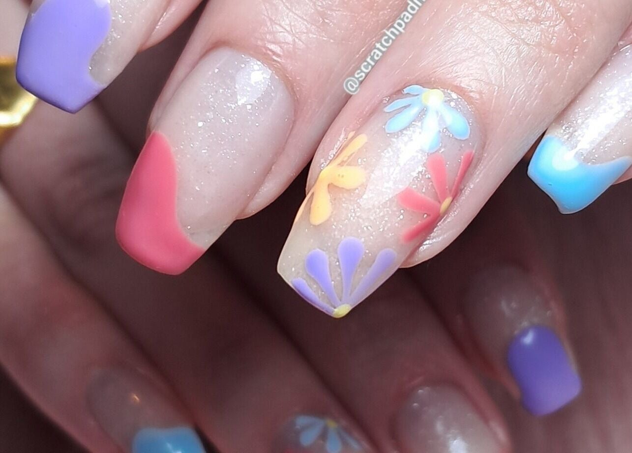 Vibrant floral nail art at Scratch Pad Nails, Waddington, England, GB showcasing unique seasonal designs.