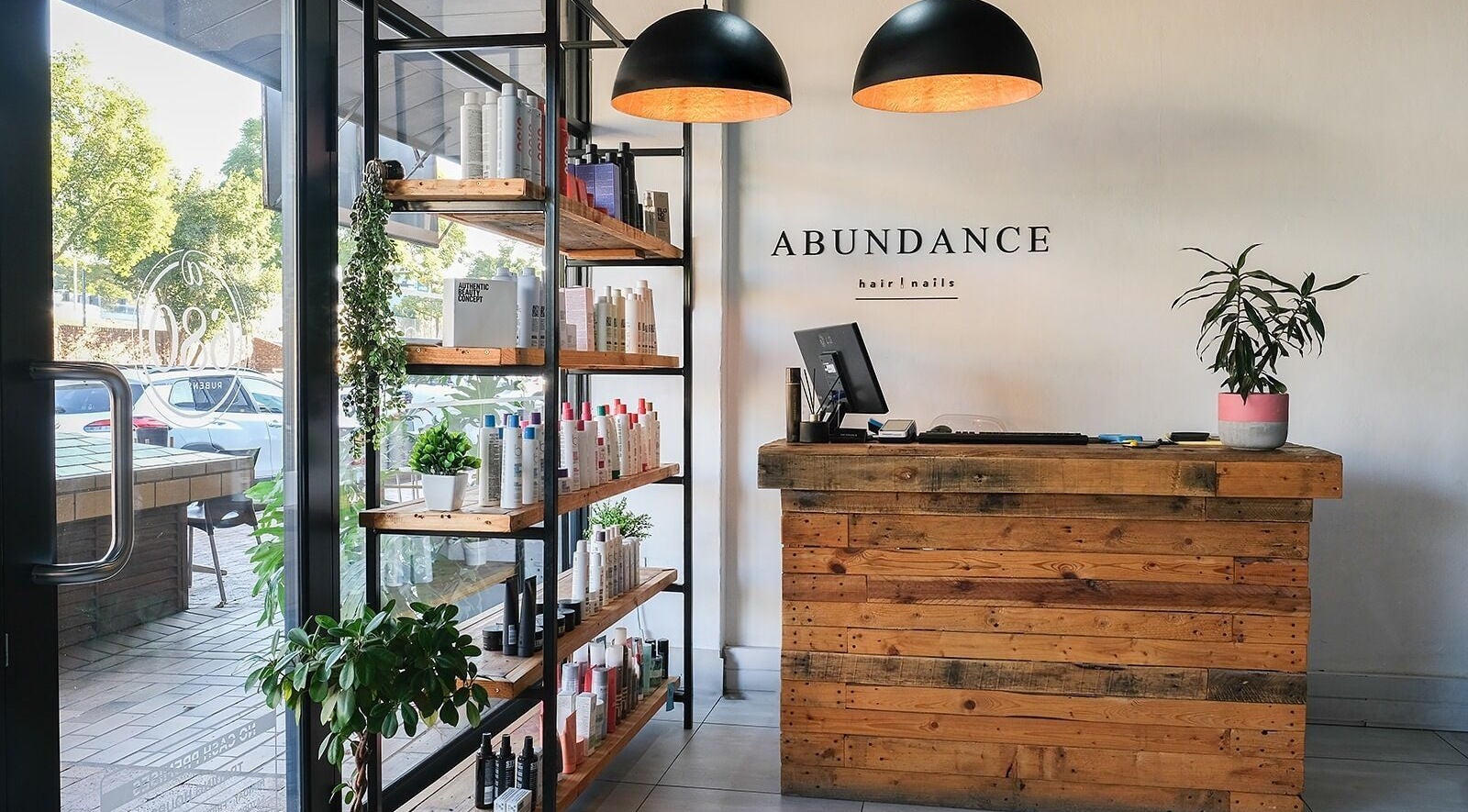 Reception area of Abundance Hair · Beauty · Nails · Aesthetics in Pretoria, Gauteng, ZA with stylish decor.