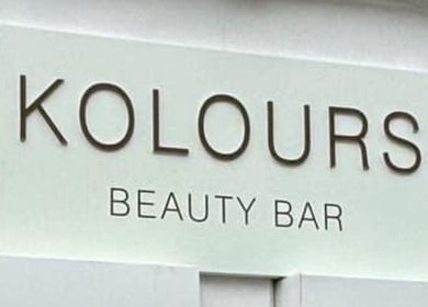 Elegant signage of Kolours Beauty Bar in Edinburgh, Scotland, GB, highlighting modern style and inviting atmosphere.