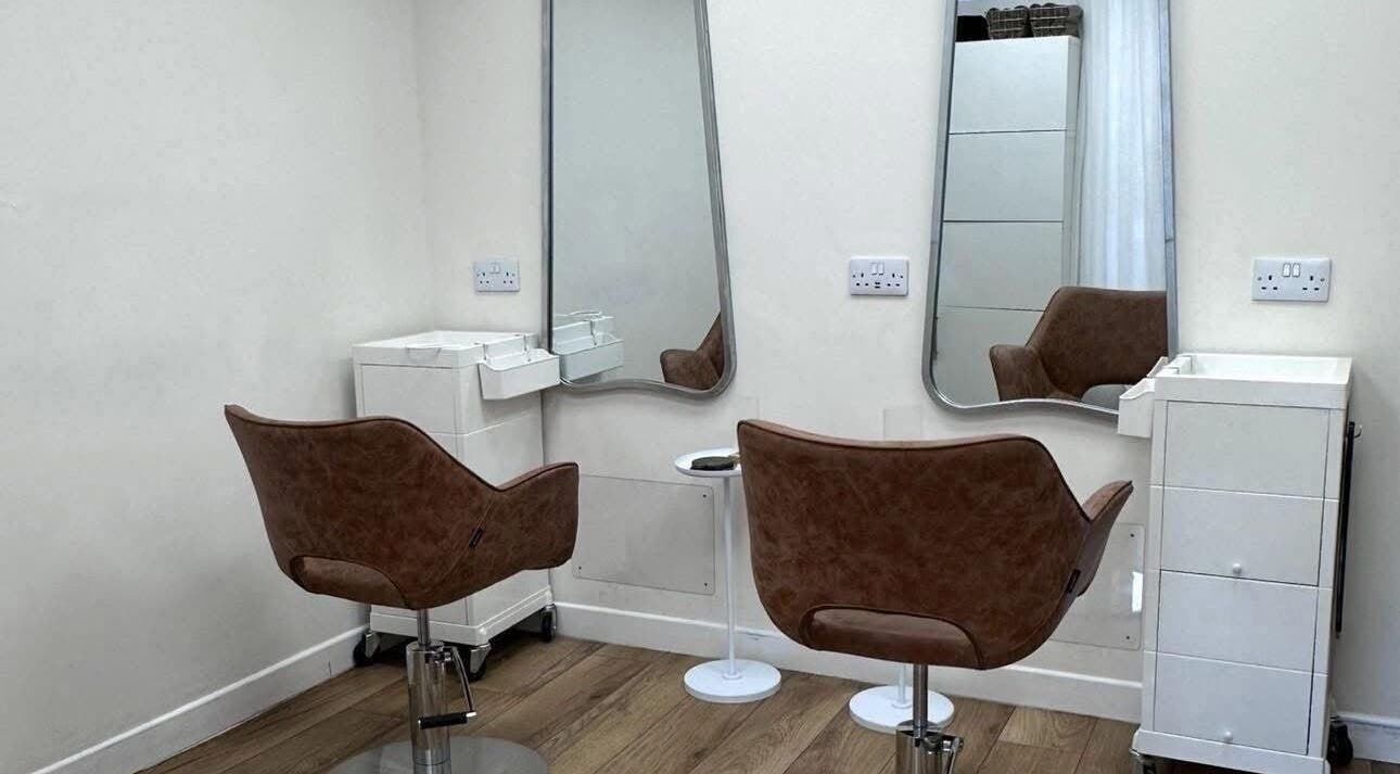 Modern salon chairs and mirrors at Kolours Beauty Bar, Edinburgh, Scotland, GB.