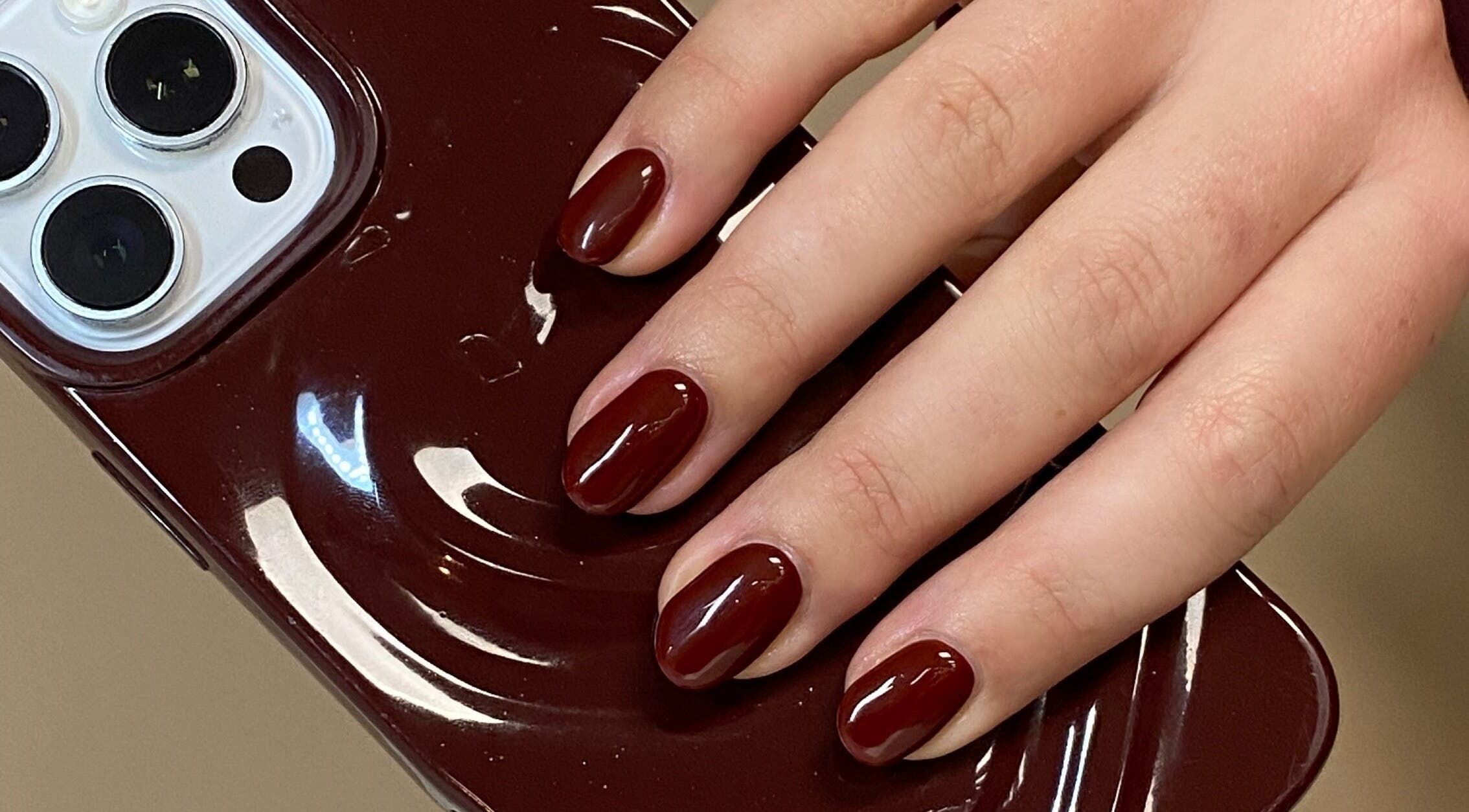 Chic burgundy gel nails at All Things Beauty By Amberx in Colwyn Bay, Wales, GB.
