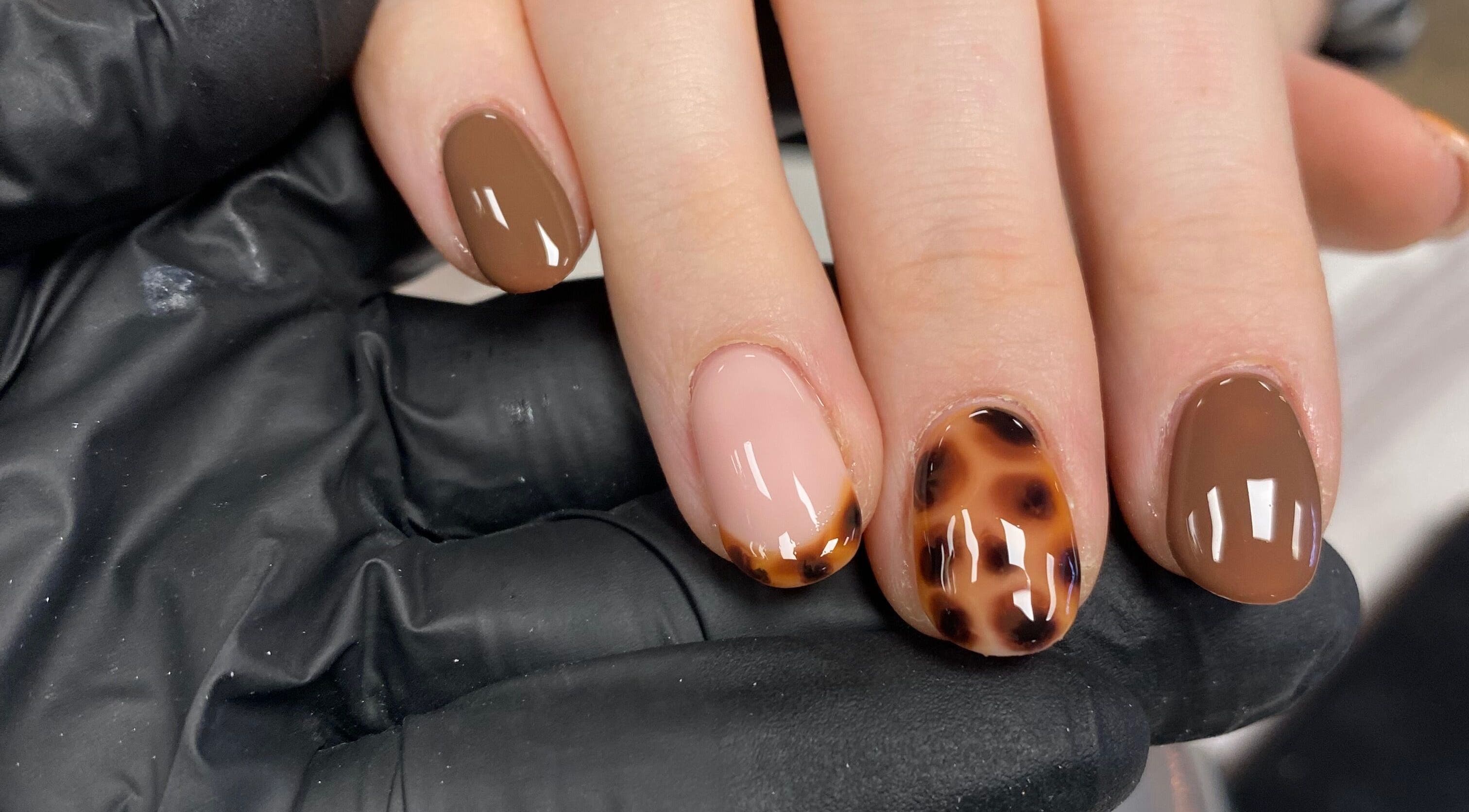 Stylish nail art at All Things Beauty By Amberx, Colwyn Bay, Wales, GB, featuring brown and tortoiseshell designs.