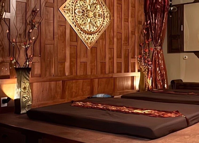 Elegant massage room at Thai Euphorea Spa & Massage, Las Vegas, Nevada, US with calming decor and ambient lighting.