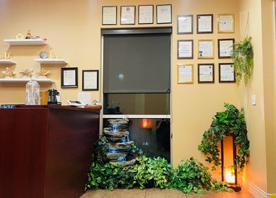 Reception area at Thai Euphorea Spa & Massage in Las Vegas, Nevada, US featuring a calming waterfall and decor.