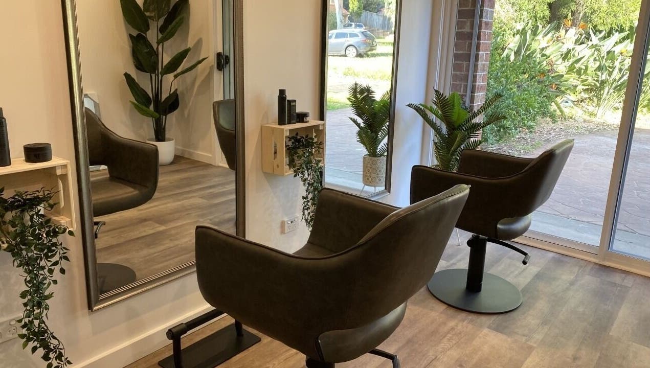 Modern, stylish Hair at HQ salon interior with lush plants in Menai, New South Wales, AU.