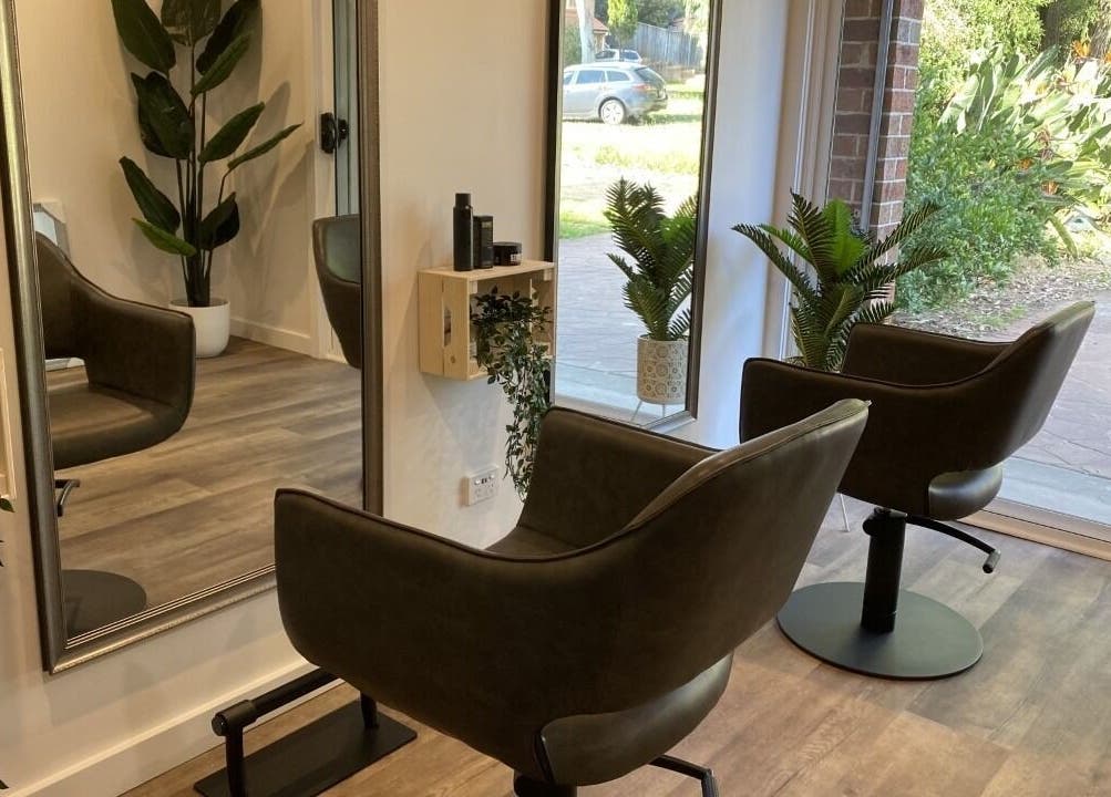 Modern, stylish Hair at HQ salon interior with lush plants in Menai, New South Wales, AU.