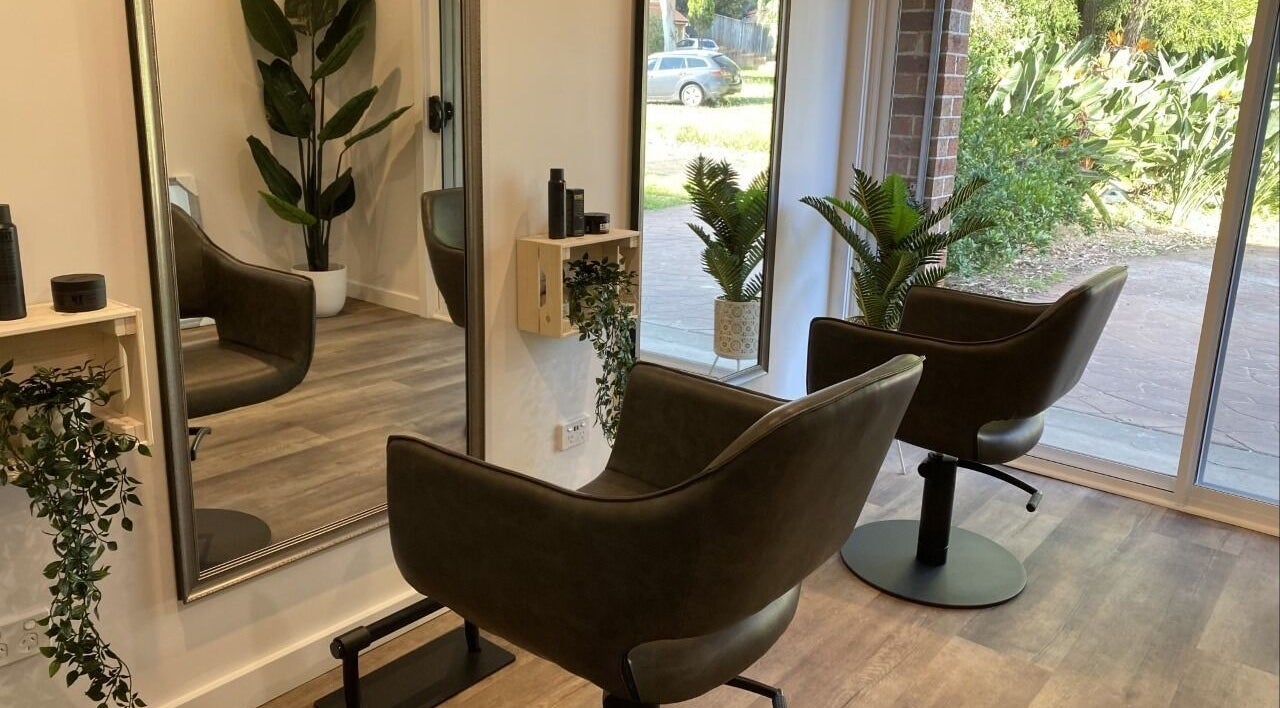 Modern, stylish Hair at HQ salon interior with lush plants in Menai, New South Wales, AU.