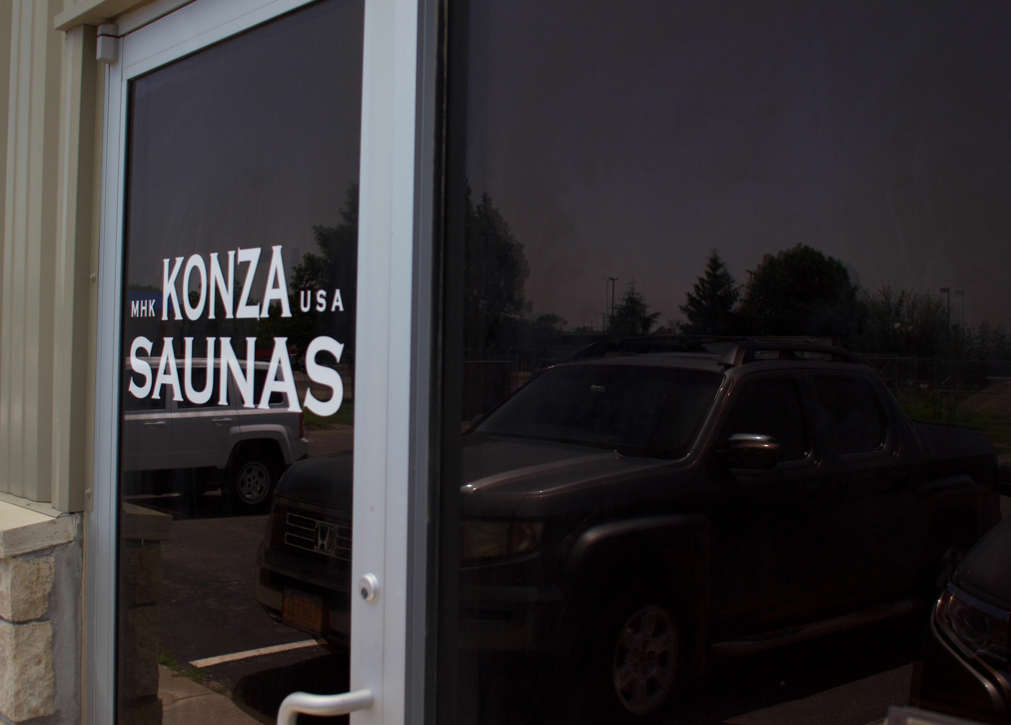 Entrance to Konza Saunas in Manhattan, Kansas, US, showcasing the venue's stylish exterior.
