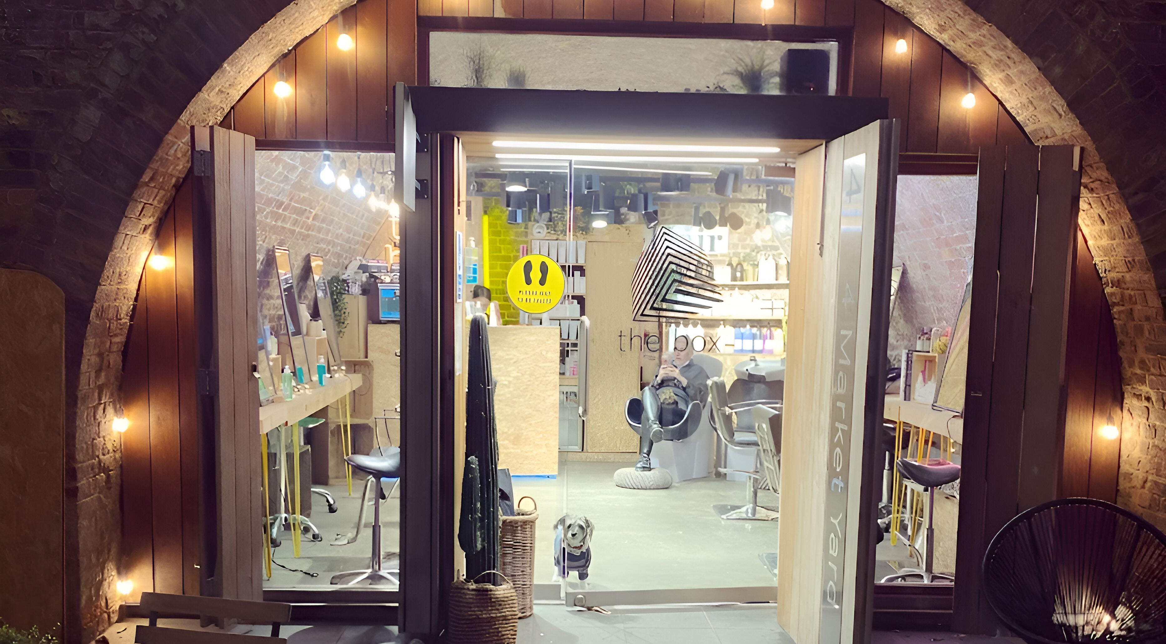 Entrance to The Box Hair Salon Deptford in London, England, GB, featuring stylish interior decor.