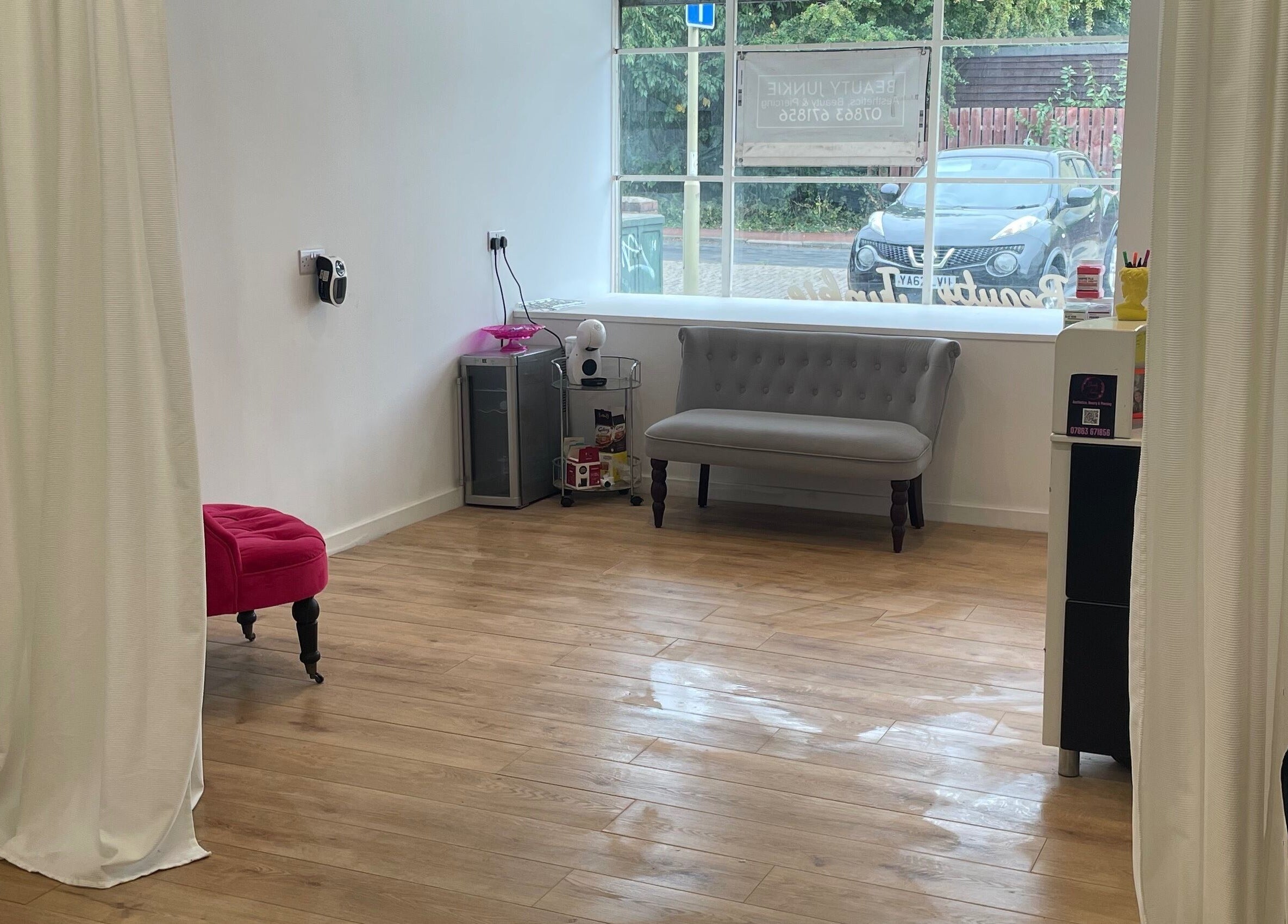 Inviting interior of Beauty Junkie, Jarrow, England, GB with modern decor and soft furnishings.