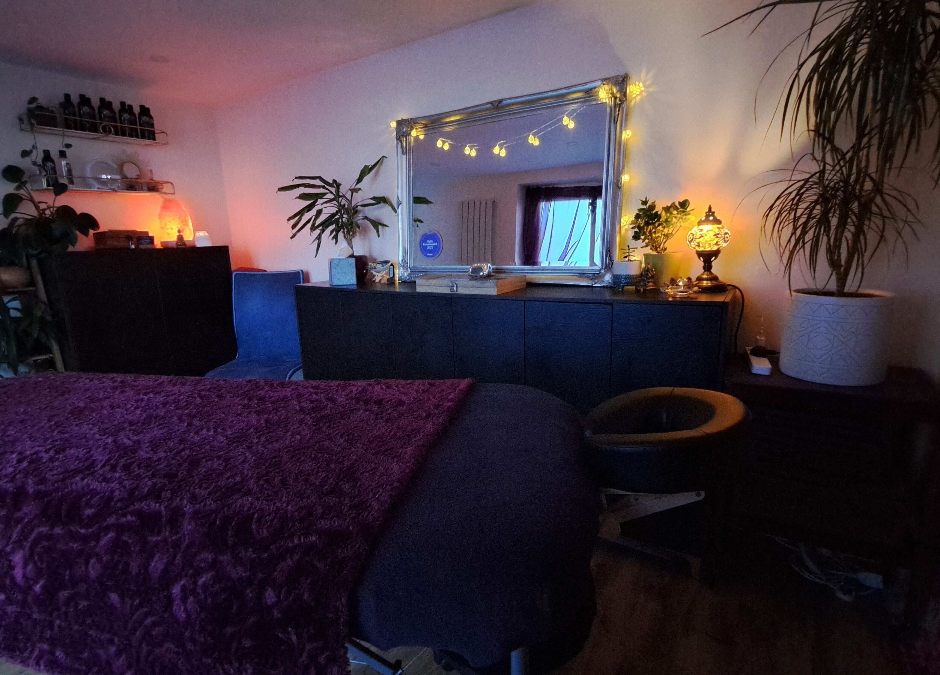 Tranquil Space Holistic Treatments room in Bristol, GB with cozy lighting and relaxing decor.