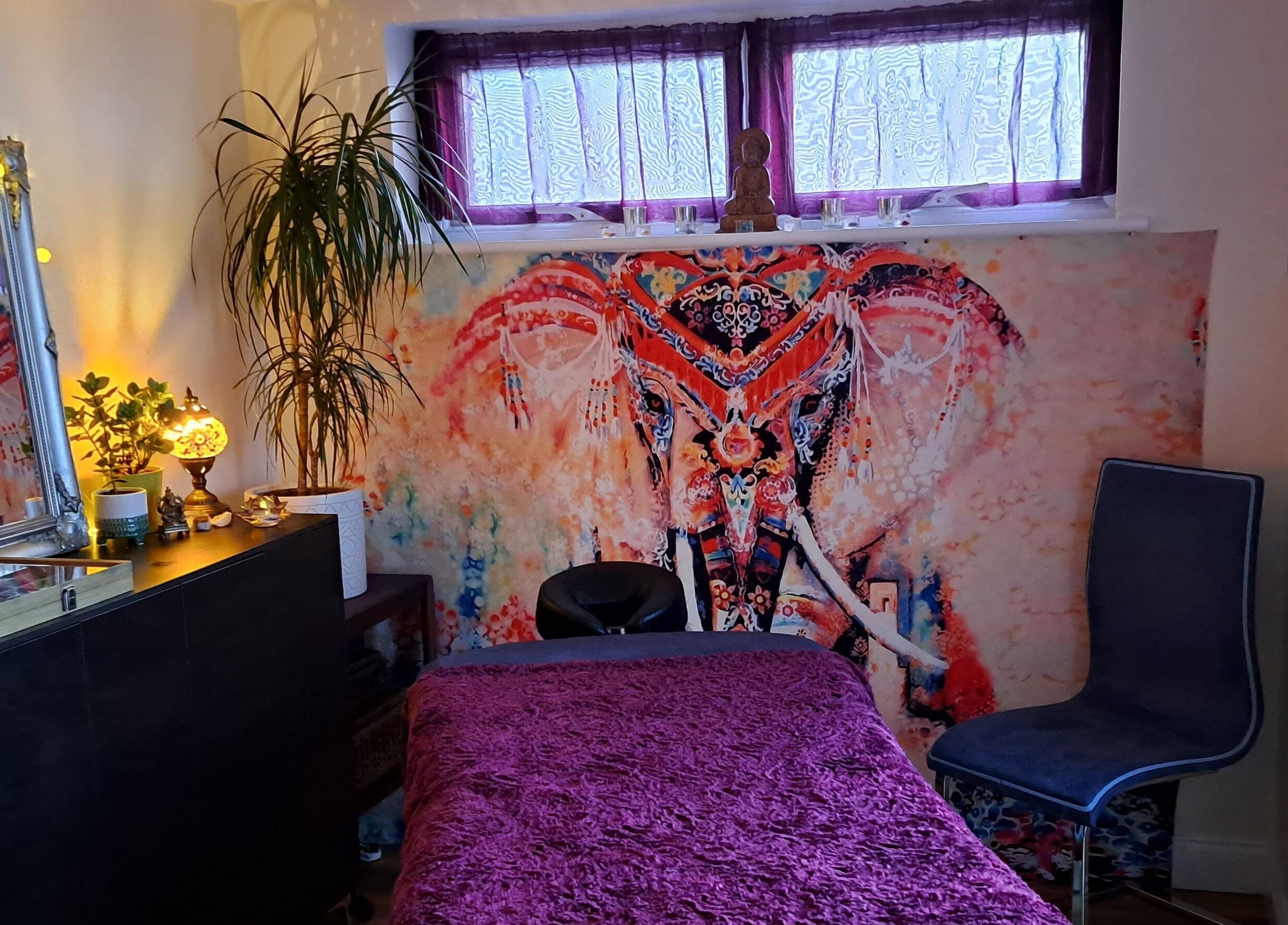 Tranquil Space Holistic Treatments therapy room with elephant tapestry, Bristol, GB.
