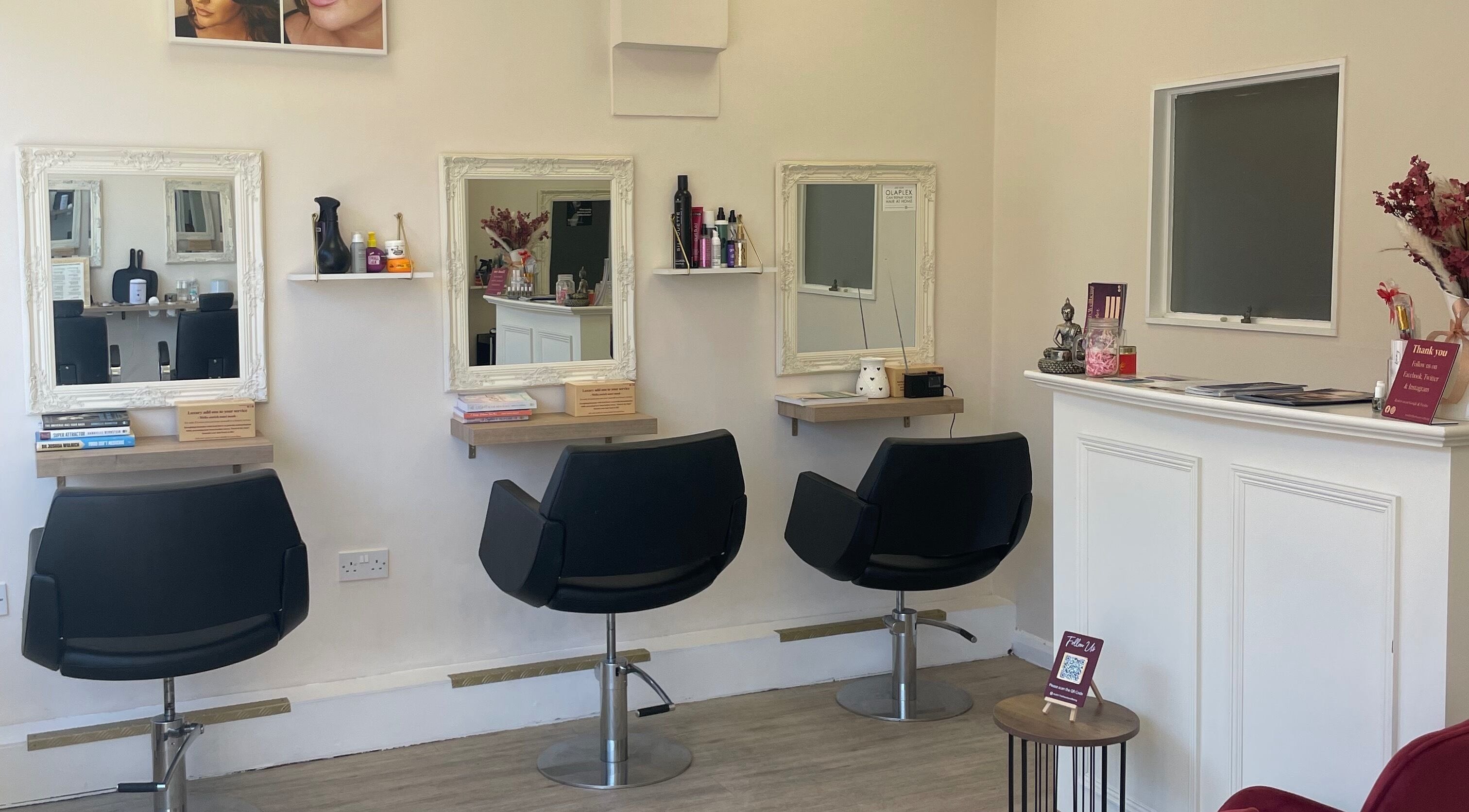 Elegant salon stations at Studio 11 Hair Beauty Wellbeing, Sidcup, England, GB, showcasing modern styling chairs.