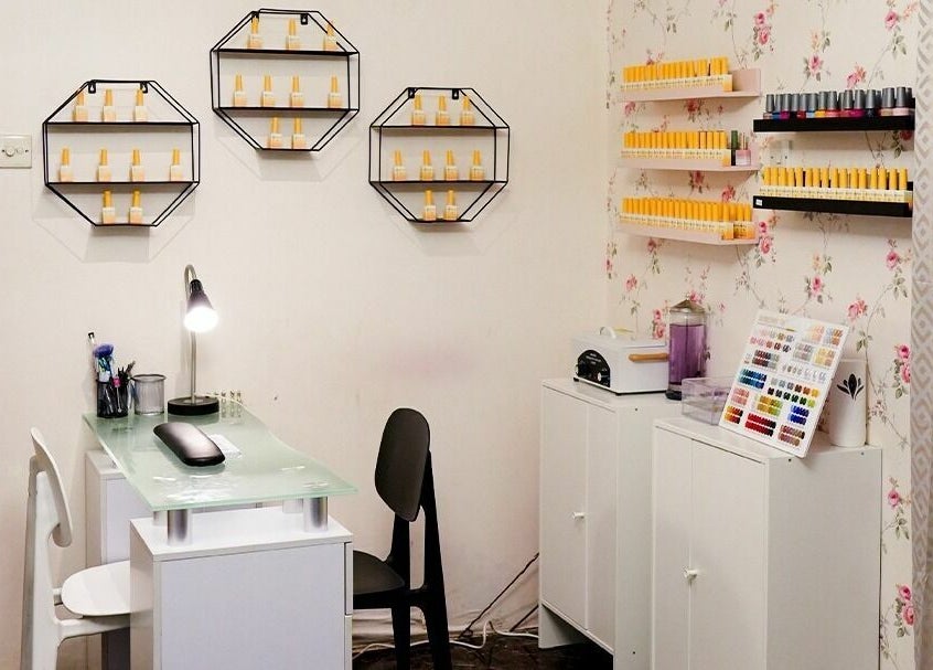 Elegant nail care station at Brows and More Salon in Dubai, Dubai, AE with modern decor and organized polishes.