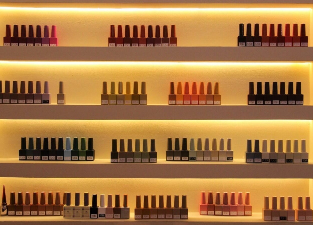 Stylish nail polish shelves at Brows and More Salon, Dubai, Dubai, AE showcasing diverse colors.