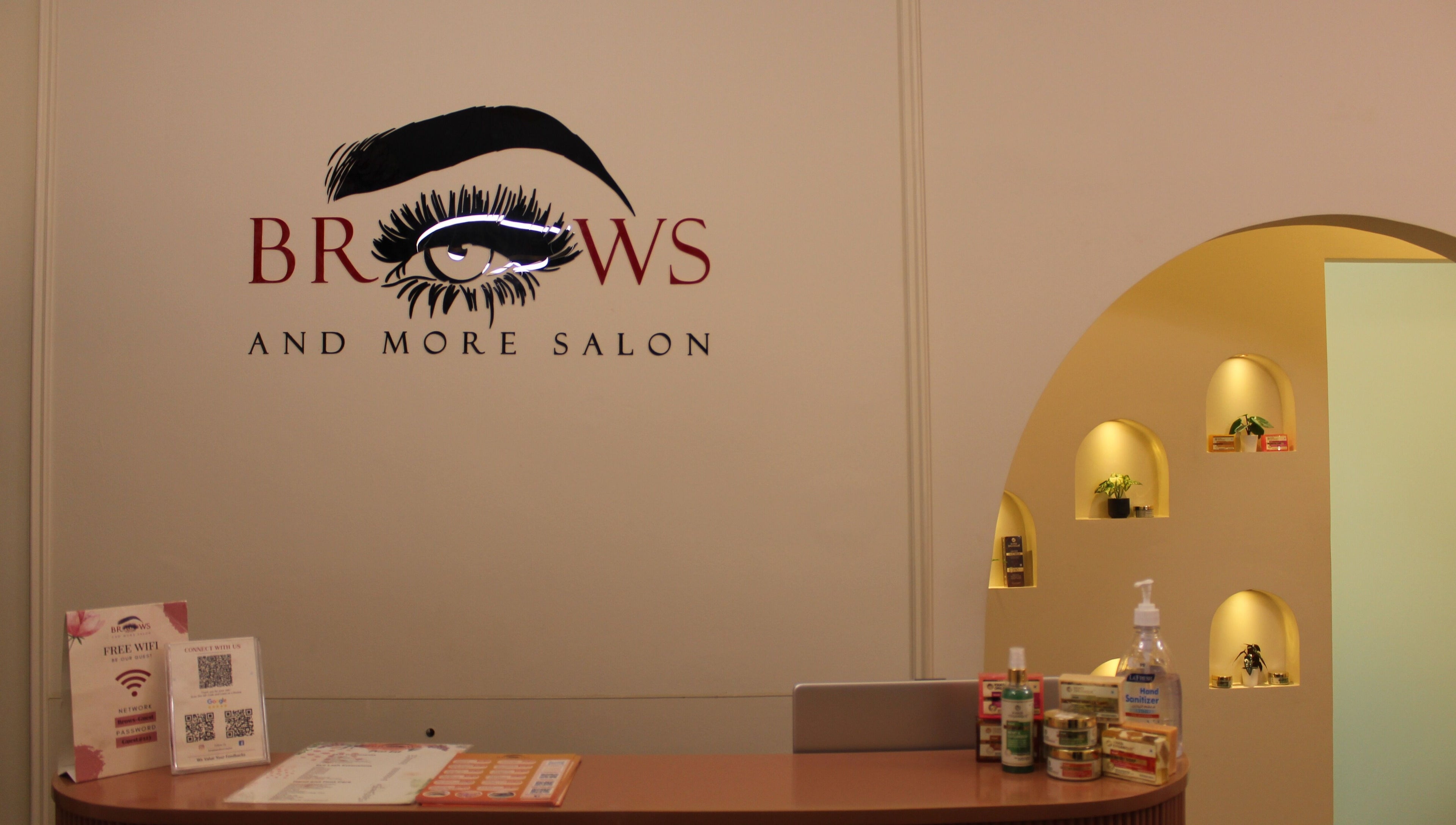 Reception of Brows and More (Karama) in Dubai, Dubai, AE featuring stylish signage and beauty products.