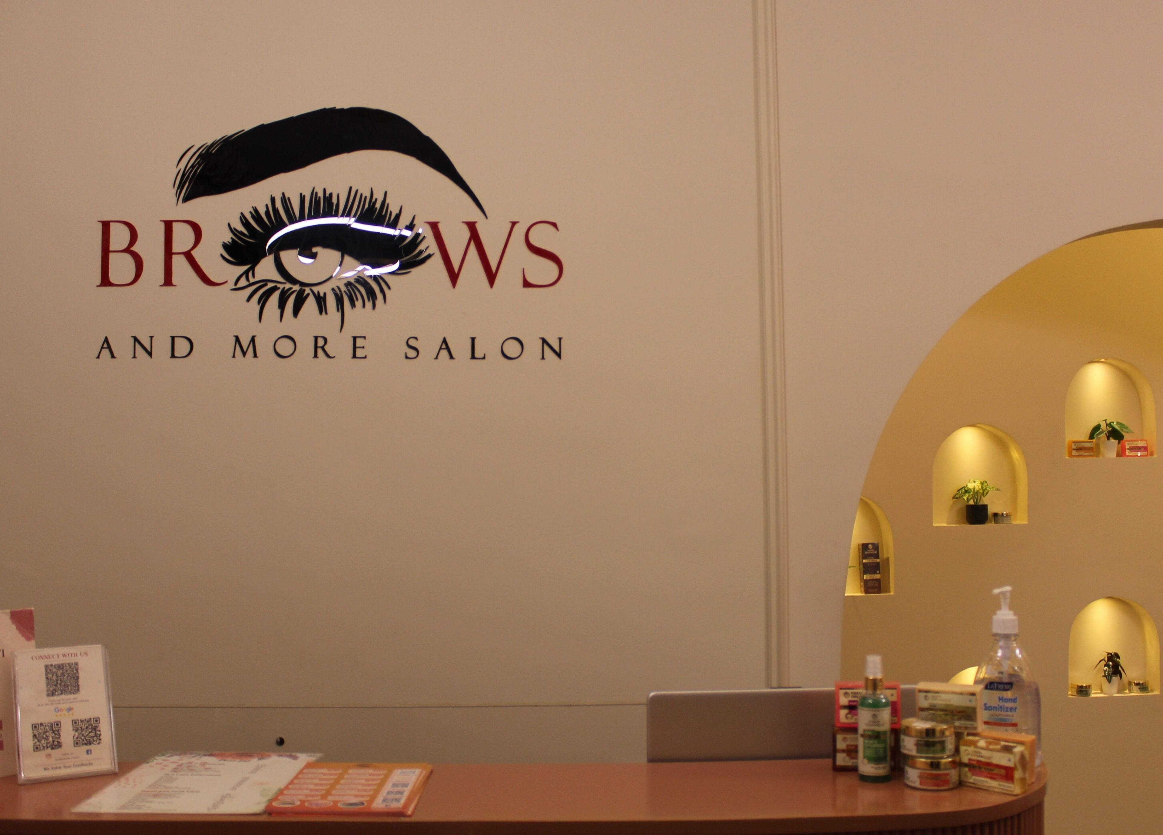 Reception of Brows and More (Karama) in Dubai, Dubai, AE featuring stylish signage and beauty products.